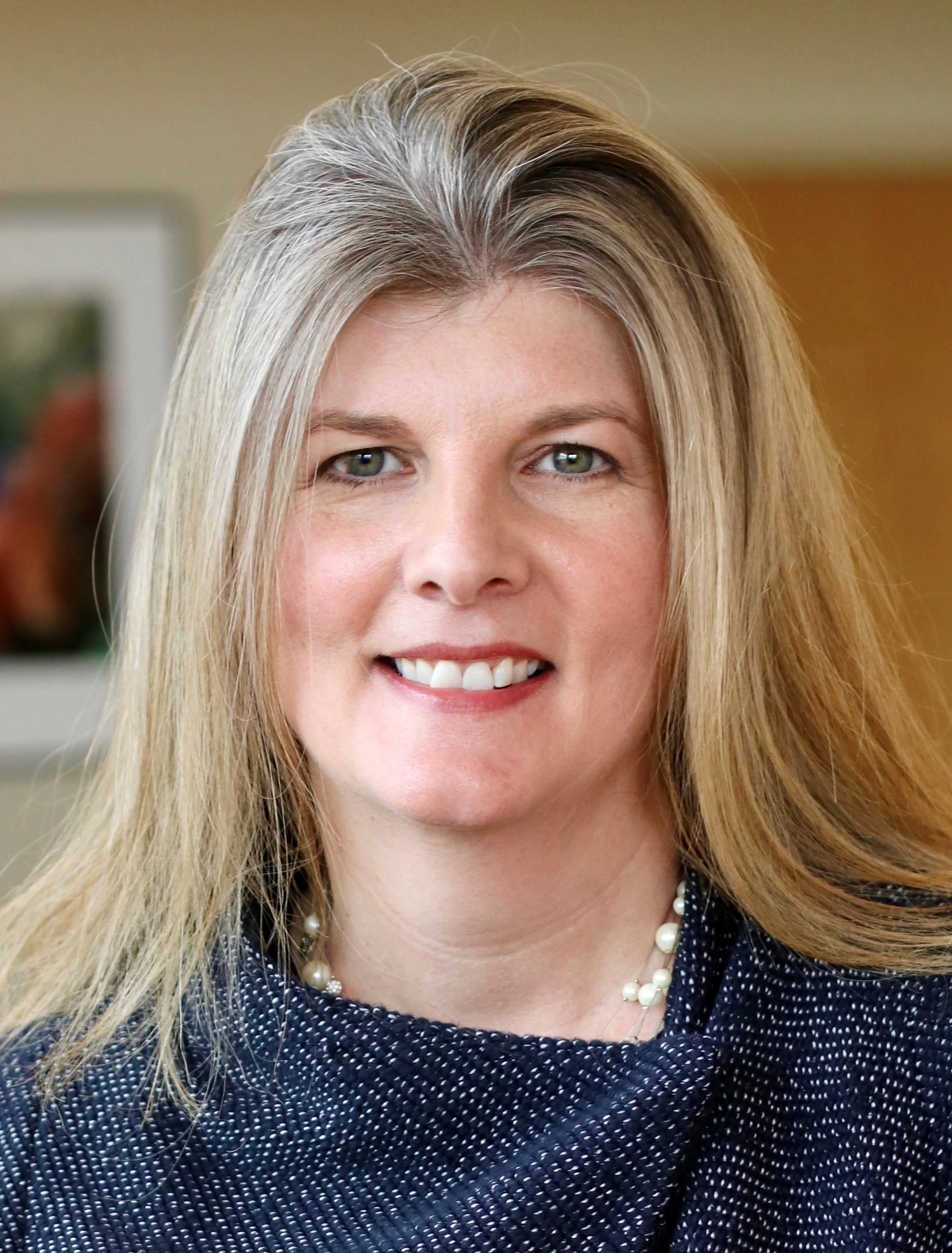 Professional headshot of Melissa Anderson owner of Heath + Home.