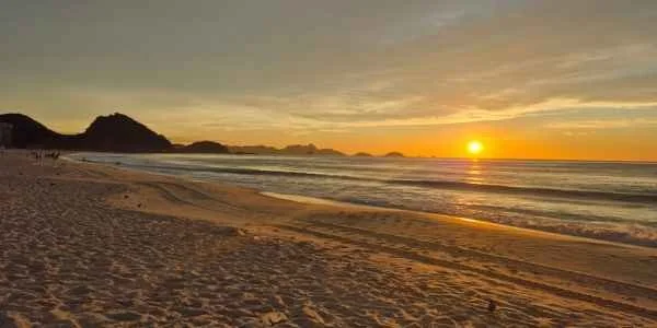 Sun rising over the ocean at Copacabana beach