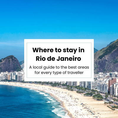 View of Ipanema beach with the mountains in the background with overlay text "Where to stay in Rio de Janeiro: a local guide for the best areas for every traveller"