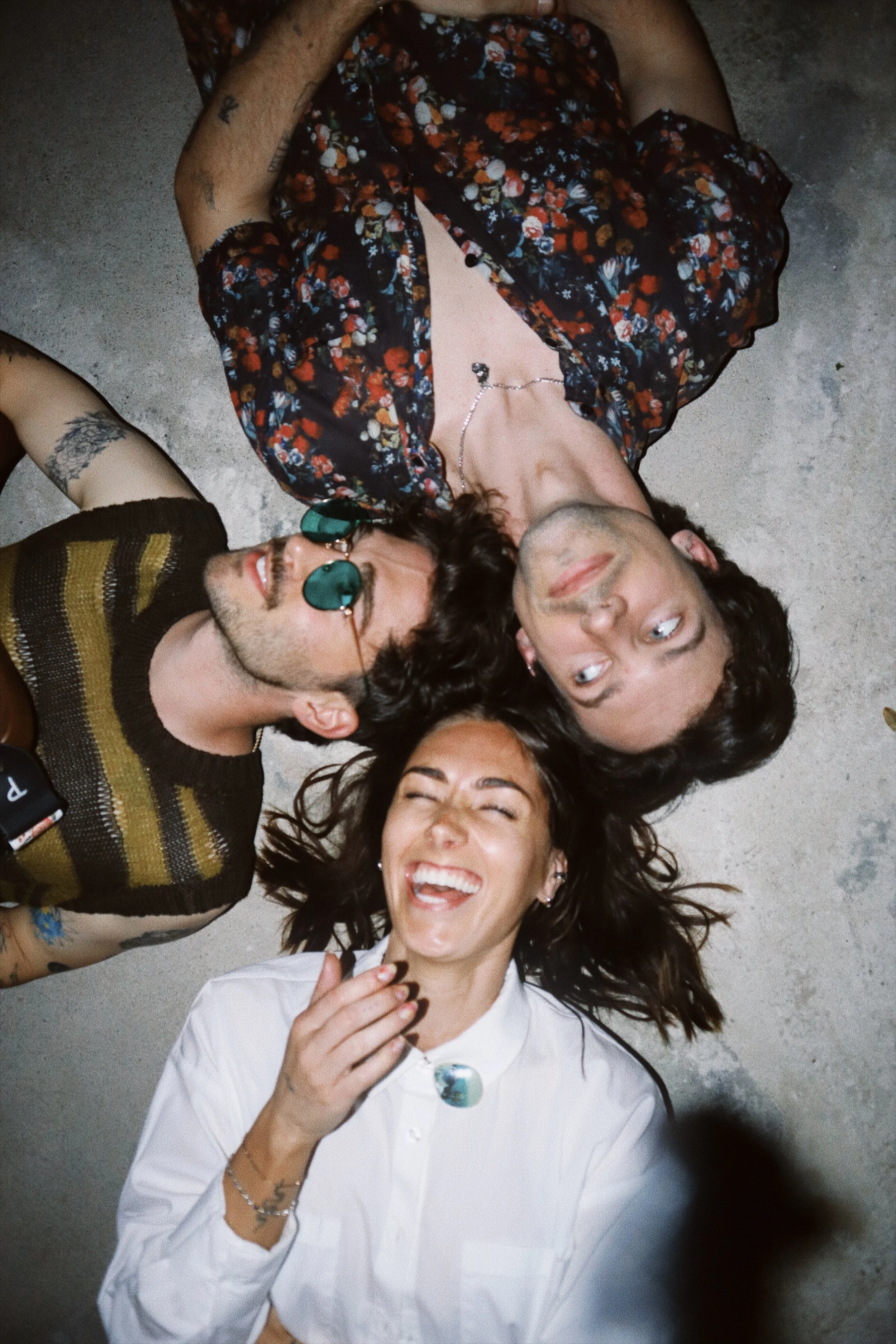 thxbby on the ground, concrete, smiling