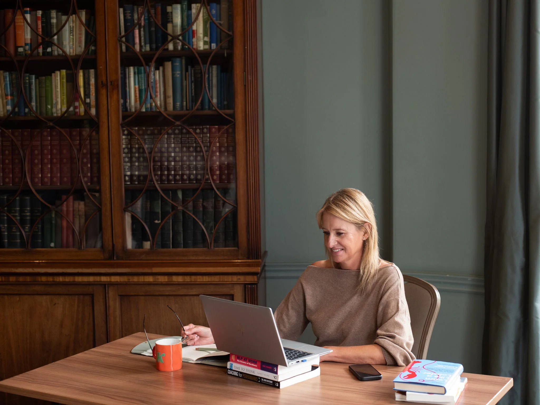Leadership coach Kate Everett-Allen working from her coaching office