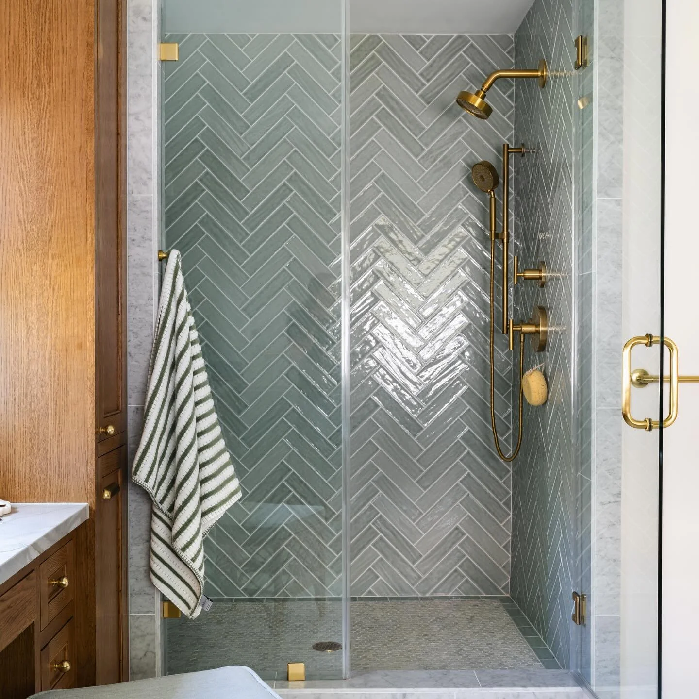 Warm wood, natural stone, soft green tile, and sunlight pouring in&mdash;this bathroom is all about bringing the outside in.

But to get here, we had to hit reset and rework the entire space.

The original layout was completely disjointed&mdash;vanit