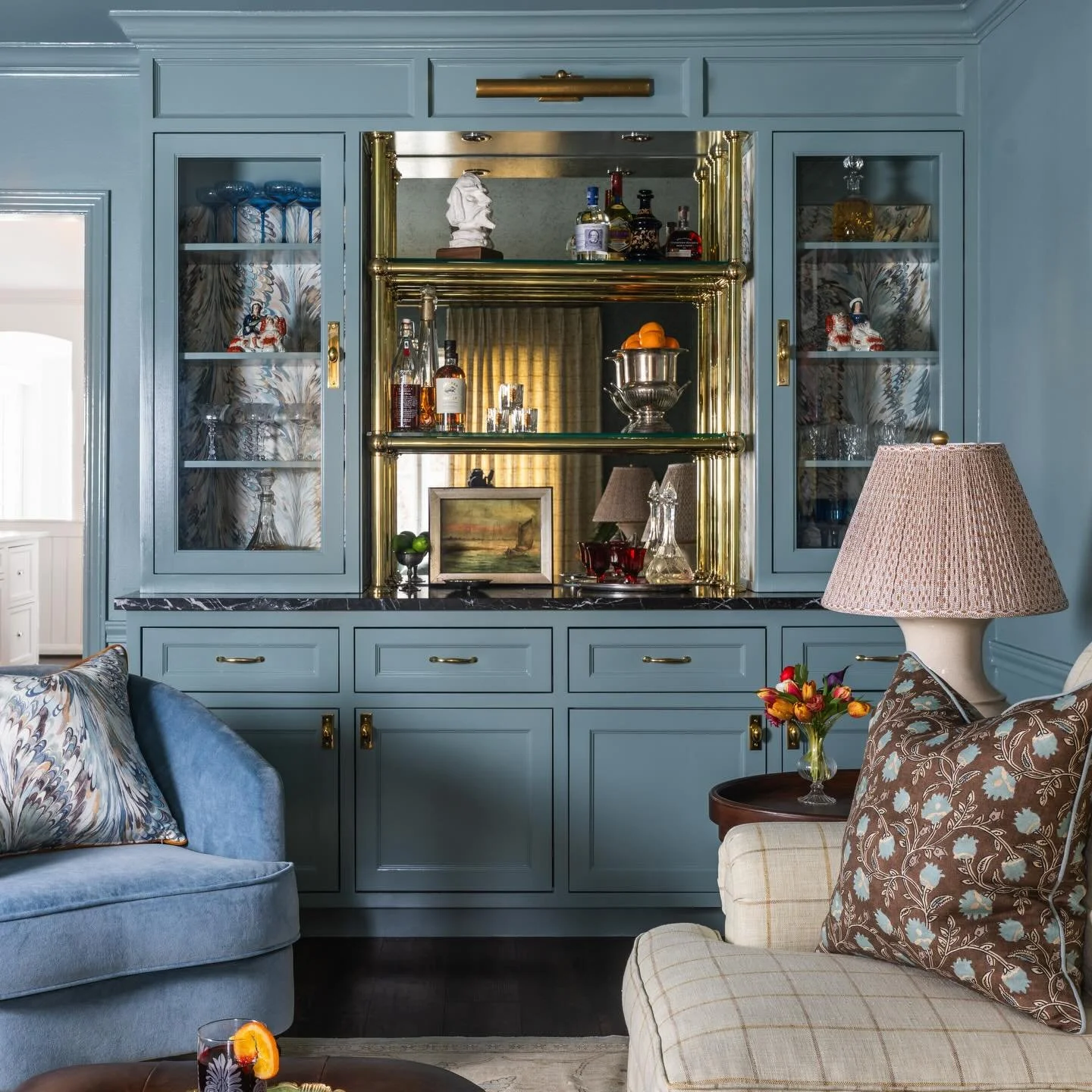 Proof that even in a house full of toys and tiny humans, you can carve out a corner that&rsquo;s all grown-up. 🎧🍸

Moody blues, brass details, and a painstakingly curated album wall that steals the show.

Reka made a special cameo on the sofa for s