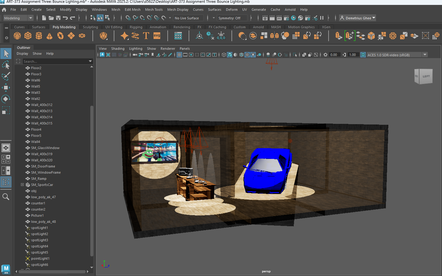 A 3D modeled room scene with a blue sports car, a wooden desk with a stereo and a landscape picture on the wall, and a beige floor with circular light spots, viewed in Autodesk Maya software.