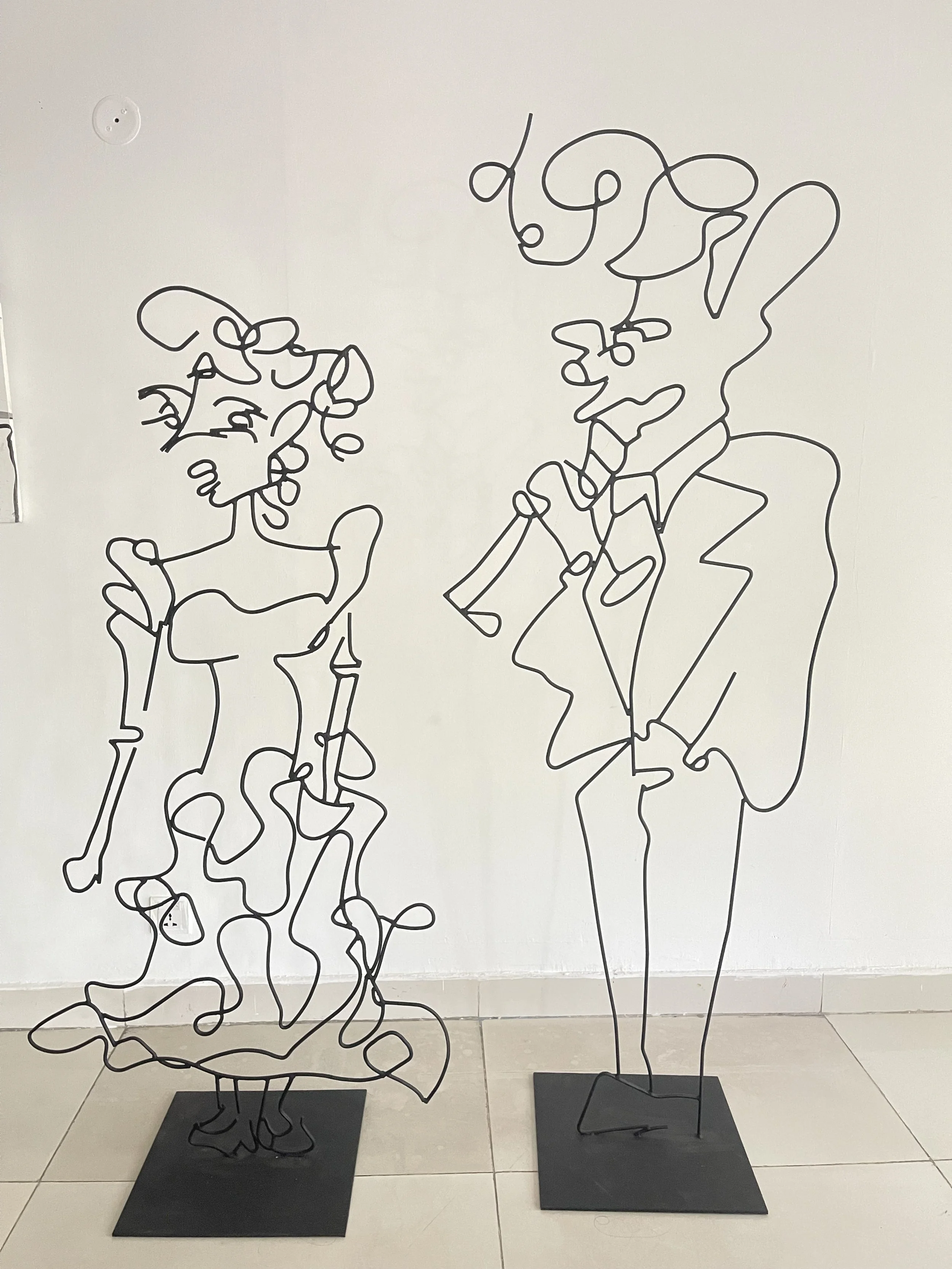 Rot Iron Sculpures / Left: The Lady In Waiting, 5 ft 2 inches / Right: The Mad Man, 6 ft 2 inches / displayed at Muse Art Gallery (solo) and Alliance Francaise de Lahore (solo)