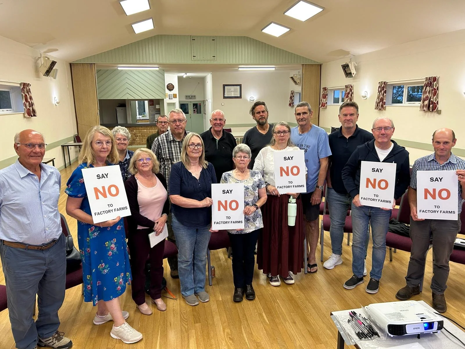 Scopwick residents, some holding signs that read 'Say no to factory farming'