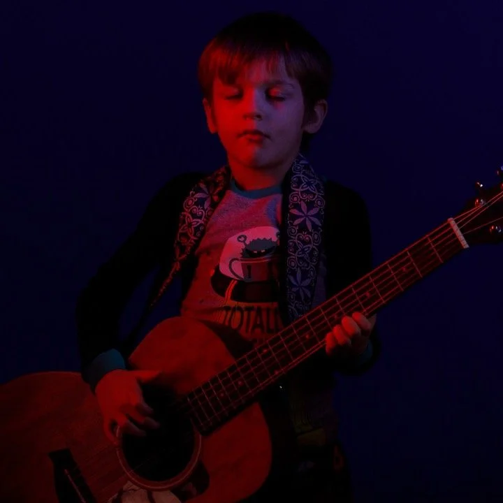 I miss my studio! This was heavily gelled with studio strobes. I had a blue/purple lighting the background and red/blue light split lighting on cams.
