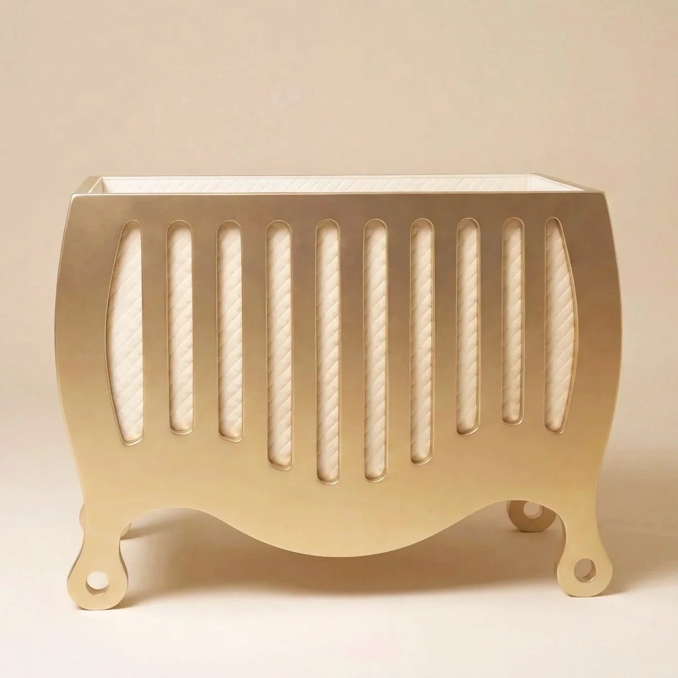 Side view of SUOMMO BELA Crib Gold, luxury baby crib finished in 18 carat gold.