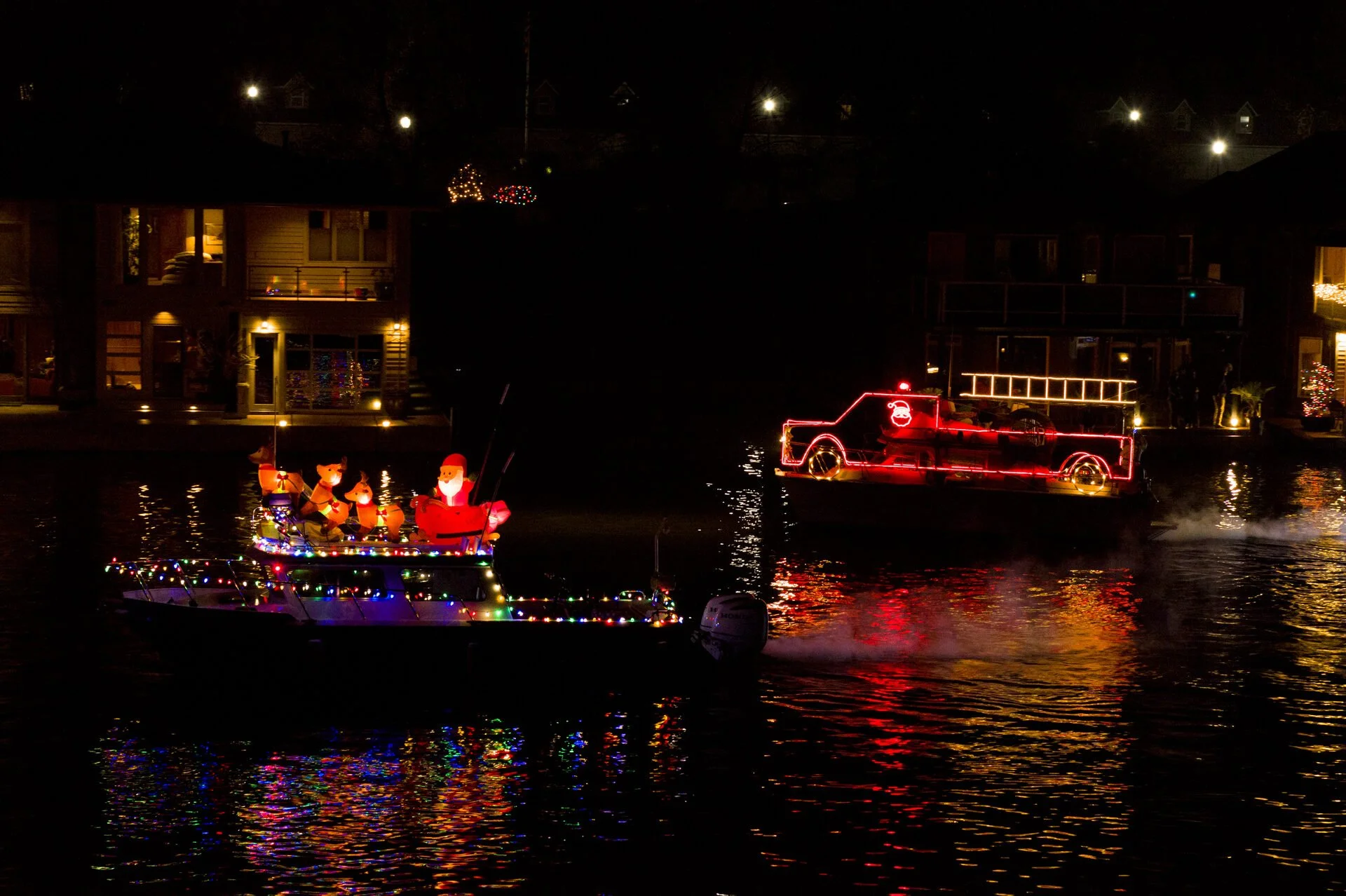 Priscilla II and Bearable (the Fire Truck) parade in front of the floating homes on the Multnomah Channel