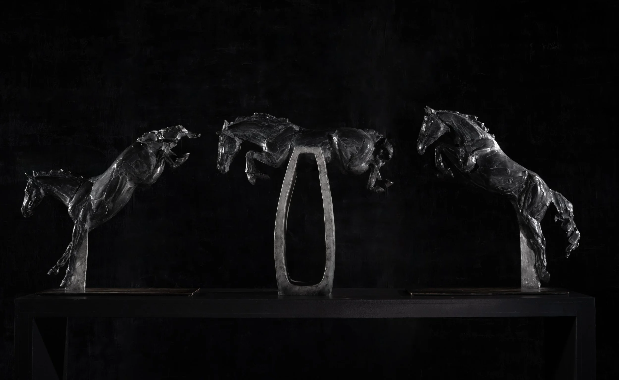 Flow State, bronze show jumping horse triptych by Stephanie Revennaugh