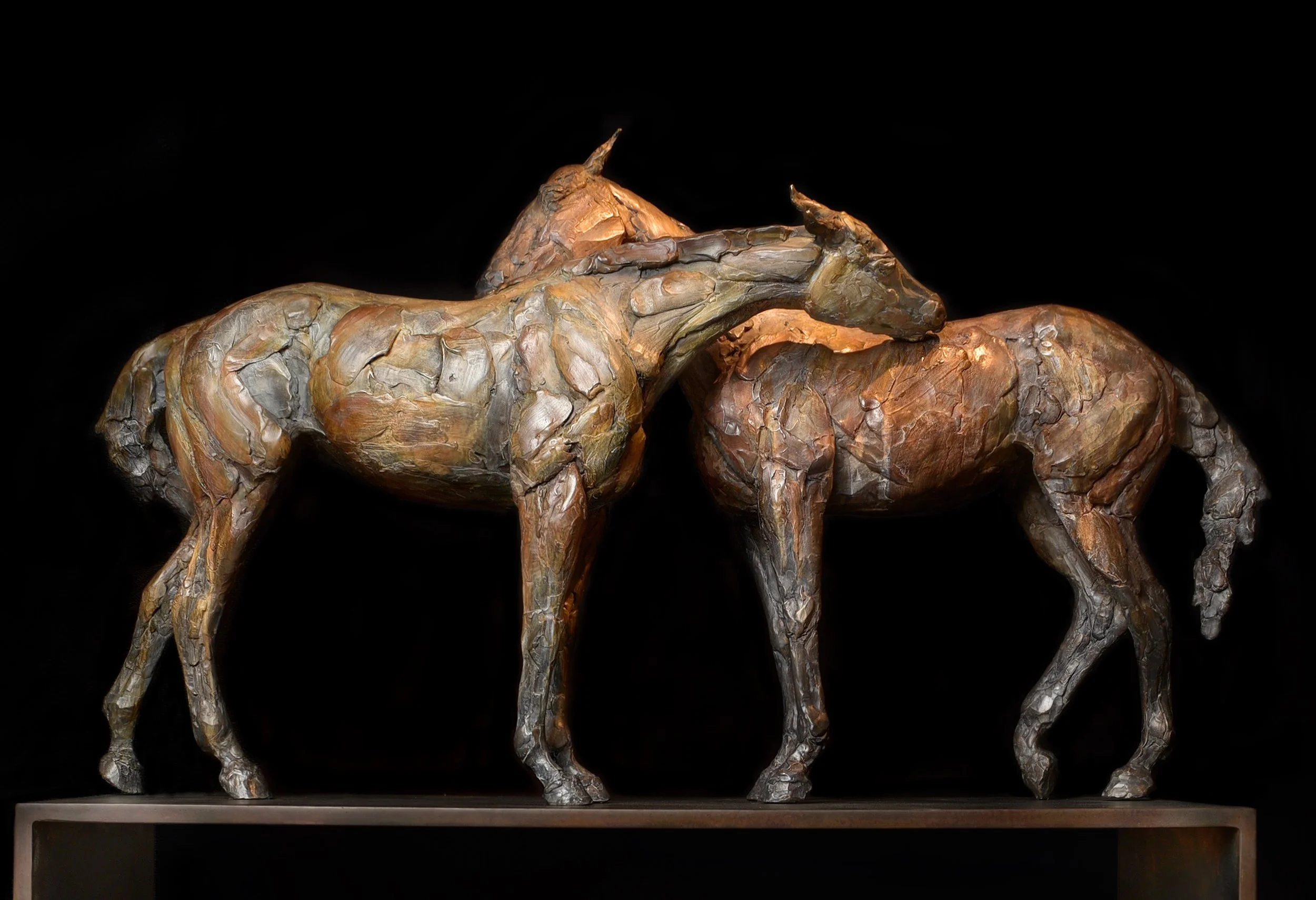 Mutual, bronze horse sculpture by Stephanie Revennaugh depicting two horses grooming one another.