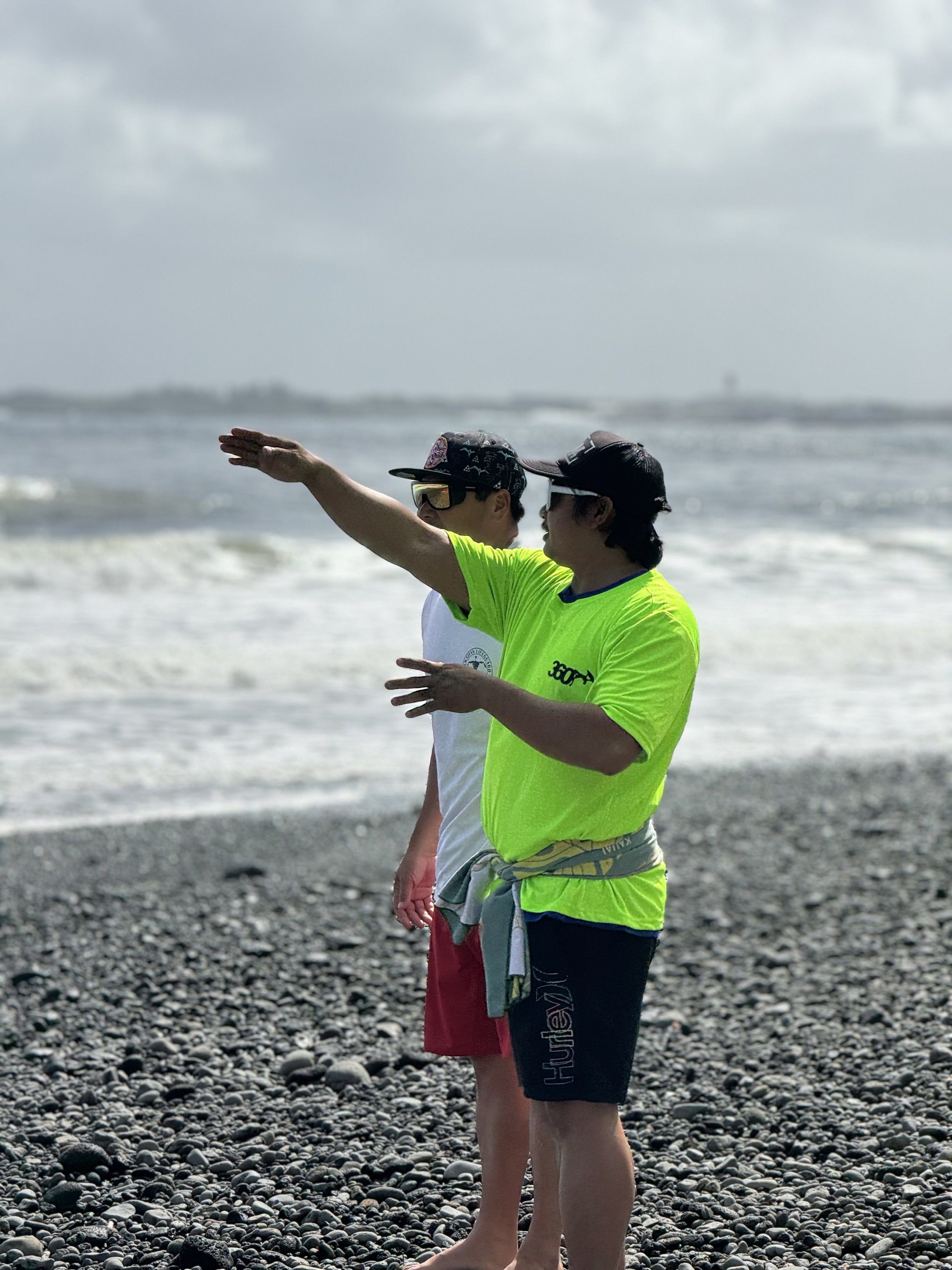 Coach Danie points to the currents coming from the river to the break that forms there called, Kapōʻai.