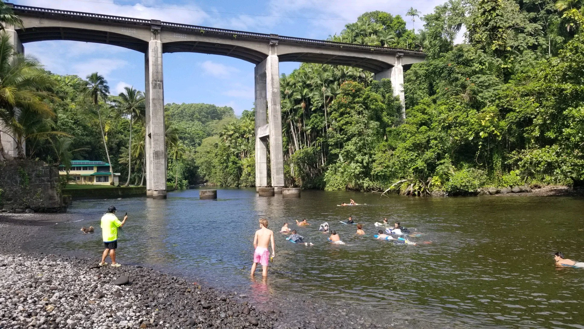 Keao takes the keiki to the river to learn how to duck dive before heading to the open water and catch waves.