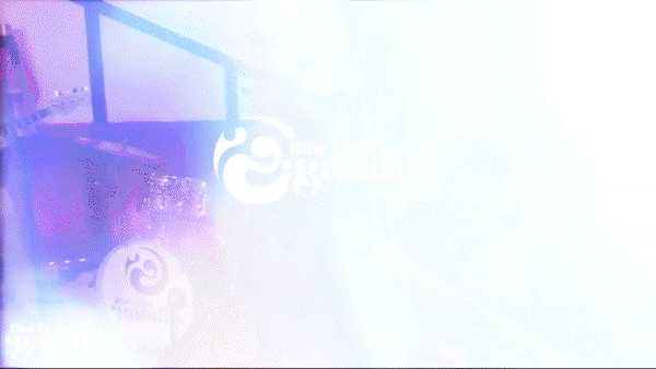 A bright, overexposed photo of a sign with the Blue Gatorade logo and text in a window.