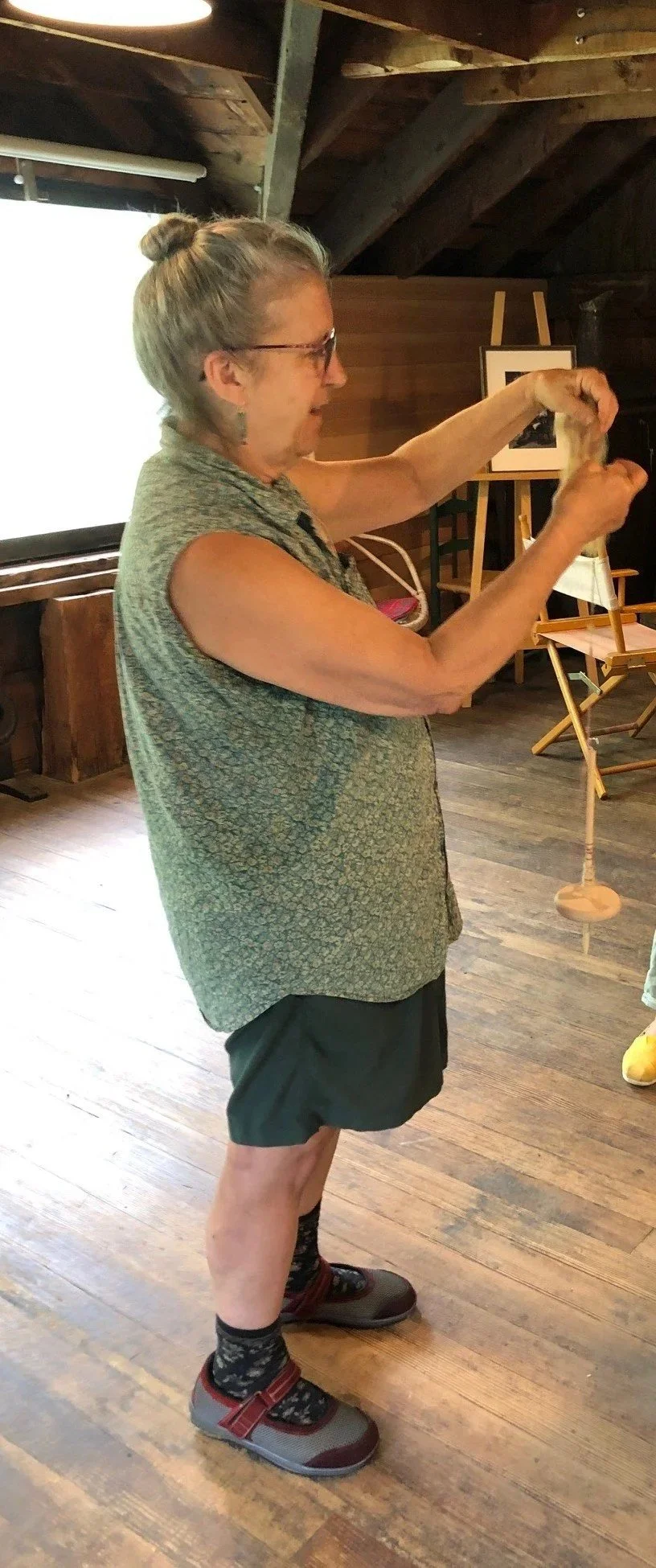 Kathy Torrey spinning yarn