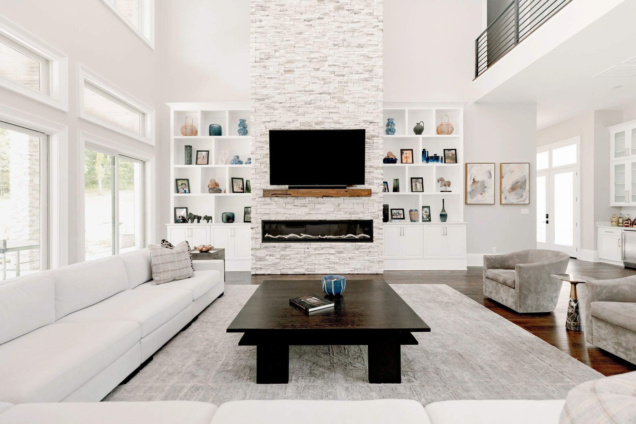 A beautifully layered living room designed to balance comfort, style, and everyday living. Thoughtful furniture placement, layered textures, and custom finishes create a space that is both functional and inviting for entertaining or quiet family mome