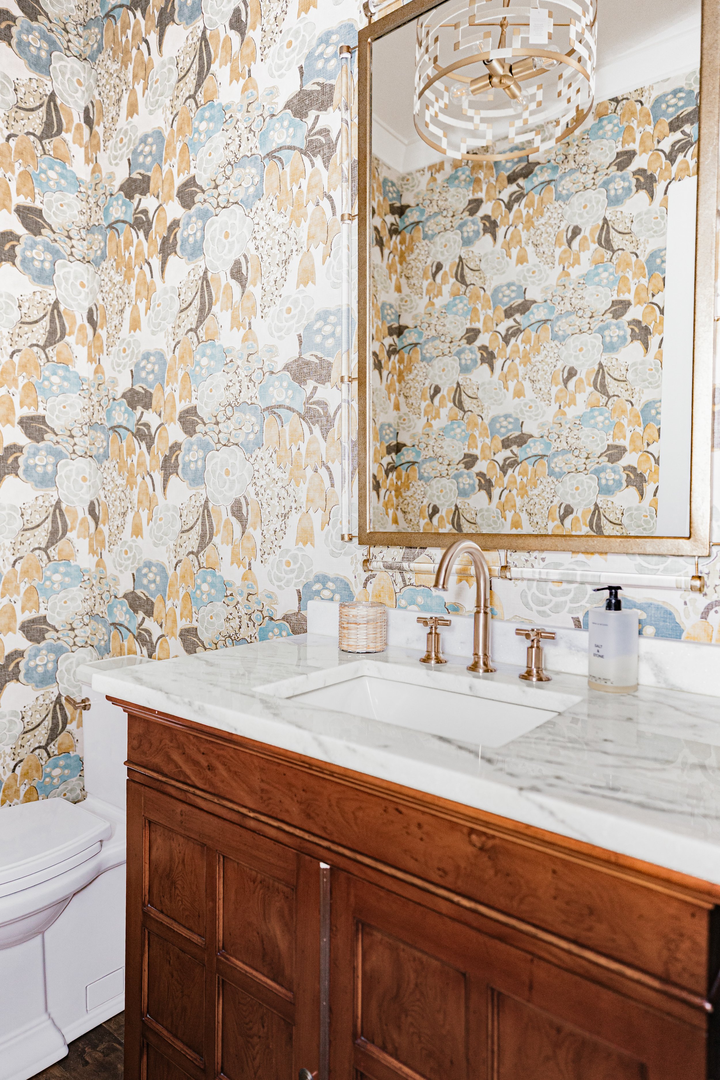 A custom powder room at Allendale designed by Cossart Design, featuring bold wallpaper, refined finishes, and tailored details. This small space blends playful personality with elevated, timeless design for a memorable guest experience.
#PowderRoomDe