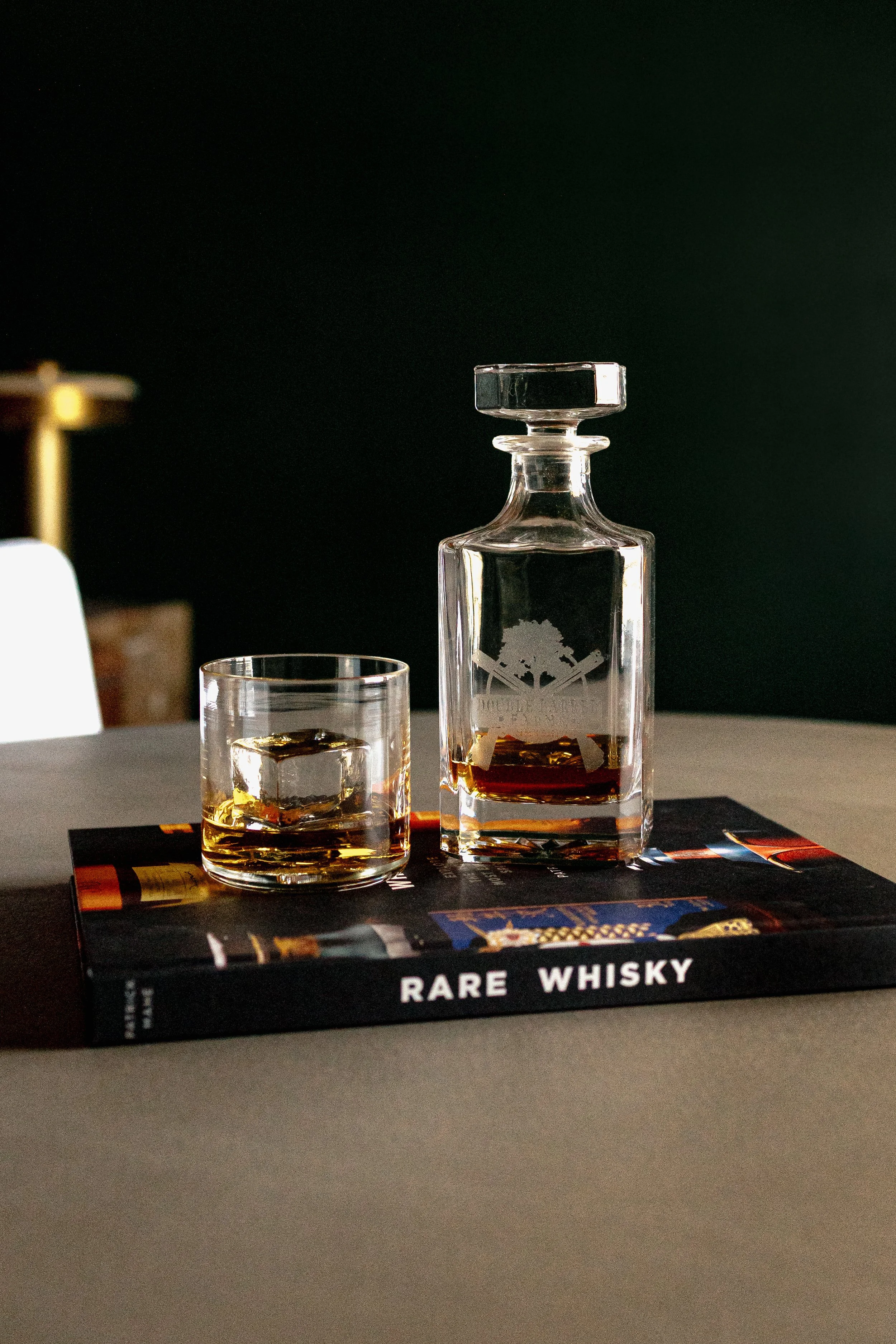 A refined cigar and whisky bar lounge designed by Cossart Design, where rich materials, warm lighting, and custom millwork come together to create a sophisticated retreat within this custom Southern home. Thoughtfully layered textures and bespoke sea