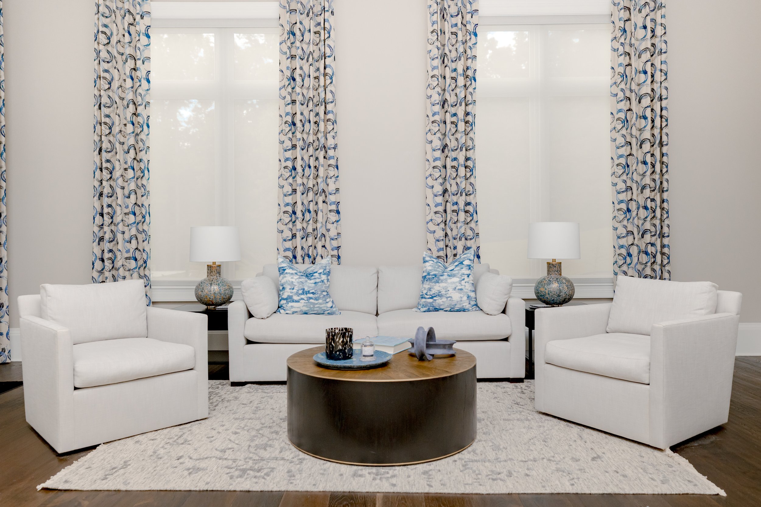 A serene master bedroom retreat designed to feel calming, refined, and restorative. Custom bedding, tailored window treatments, and motorized shades create a luxurious yet peaceful environment. Soft textures and intentional layering support daily com