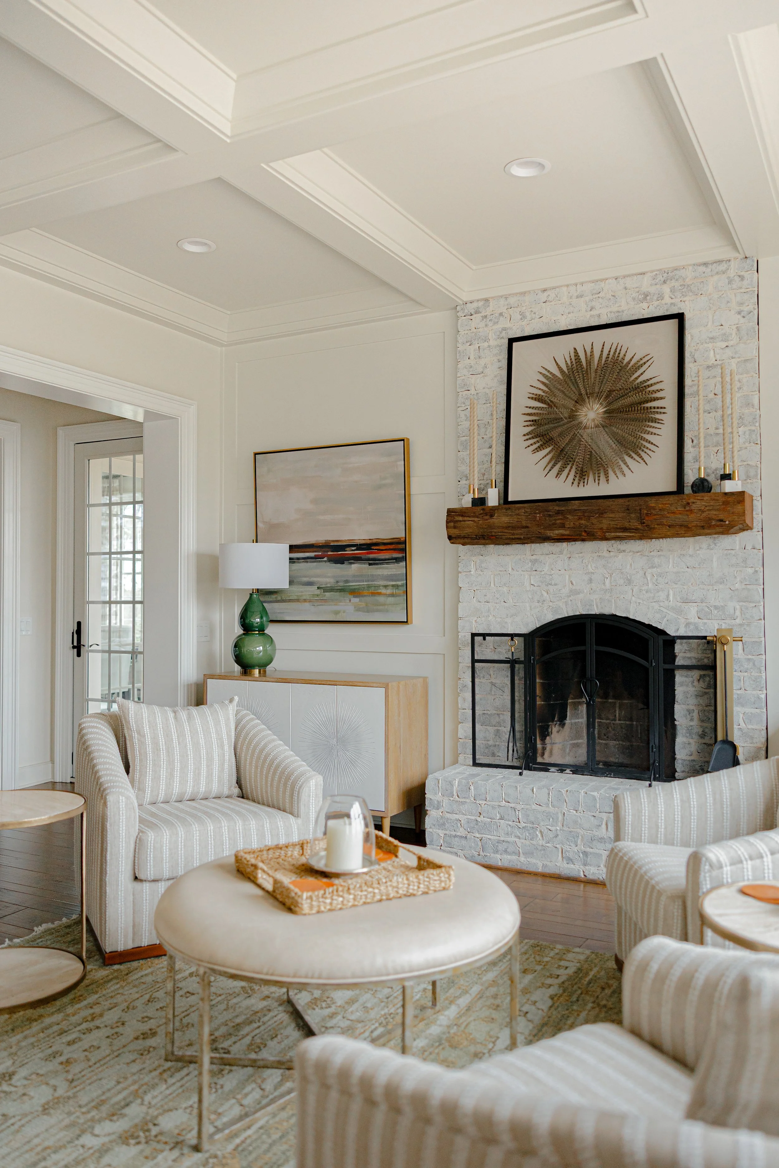 A spacious and functional living area by Cossart Design, featuring custom furnishings and layered textures for comfort and sophistication fit for a magazine spread. This Allendale home’s main living space blends timeless design with practical eleganc