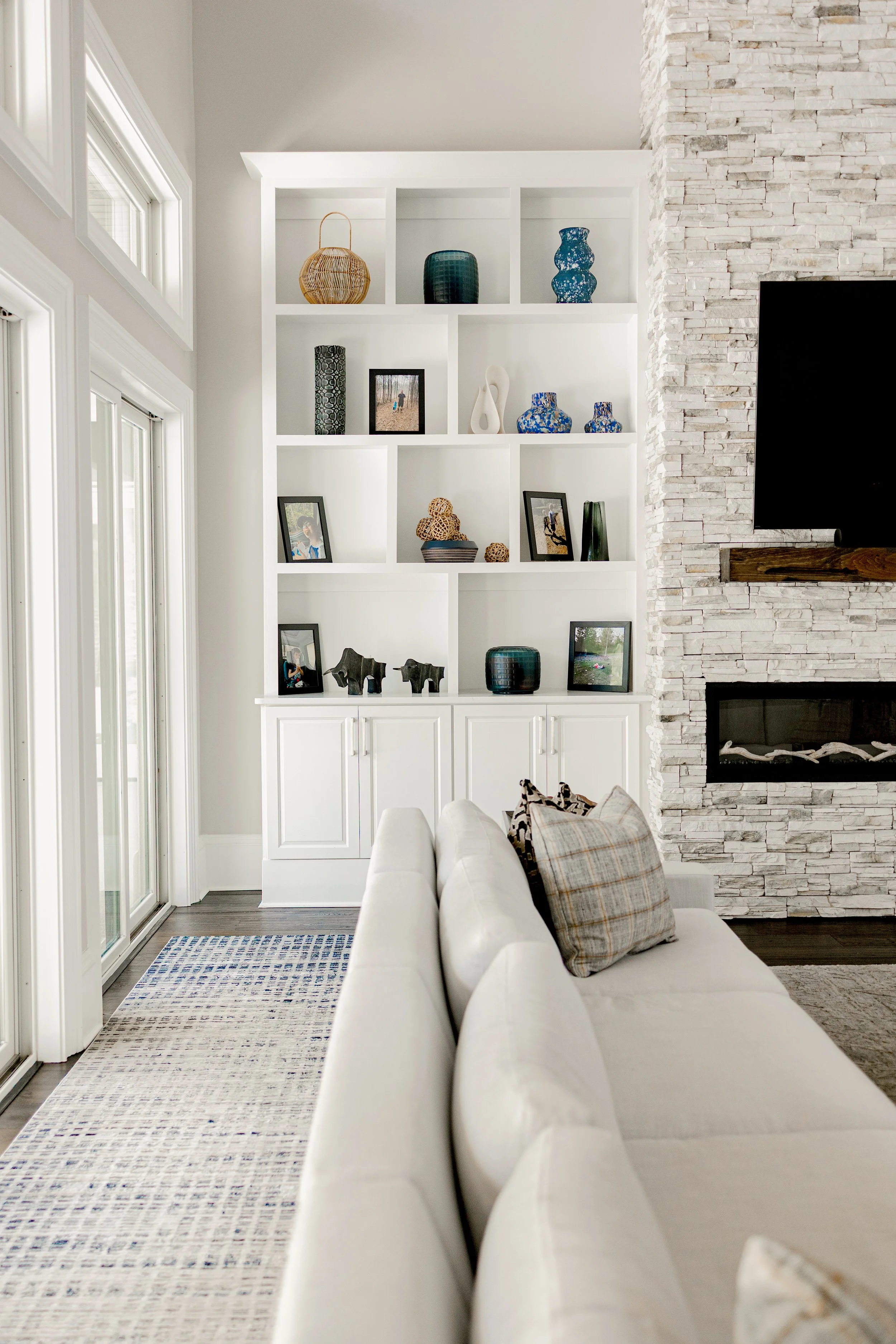 A beautifully layered living room designed to balance comfort, style, and everyday living. Thoughtful furniture placement, layered textures, and custom finishes create a space that is both functional and inviting for entertaining or quiet family mome