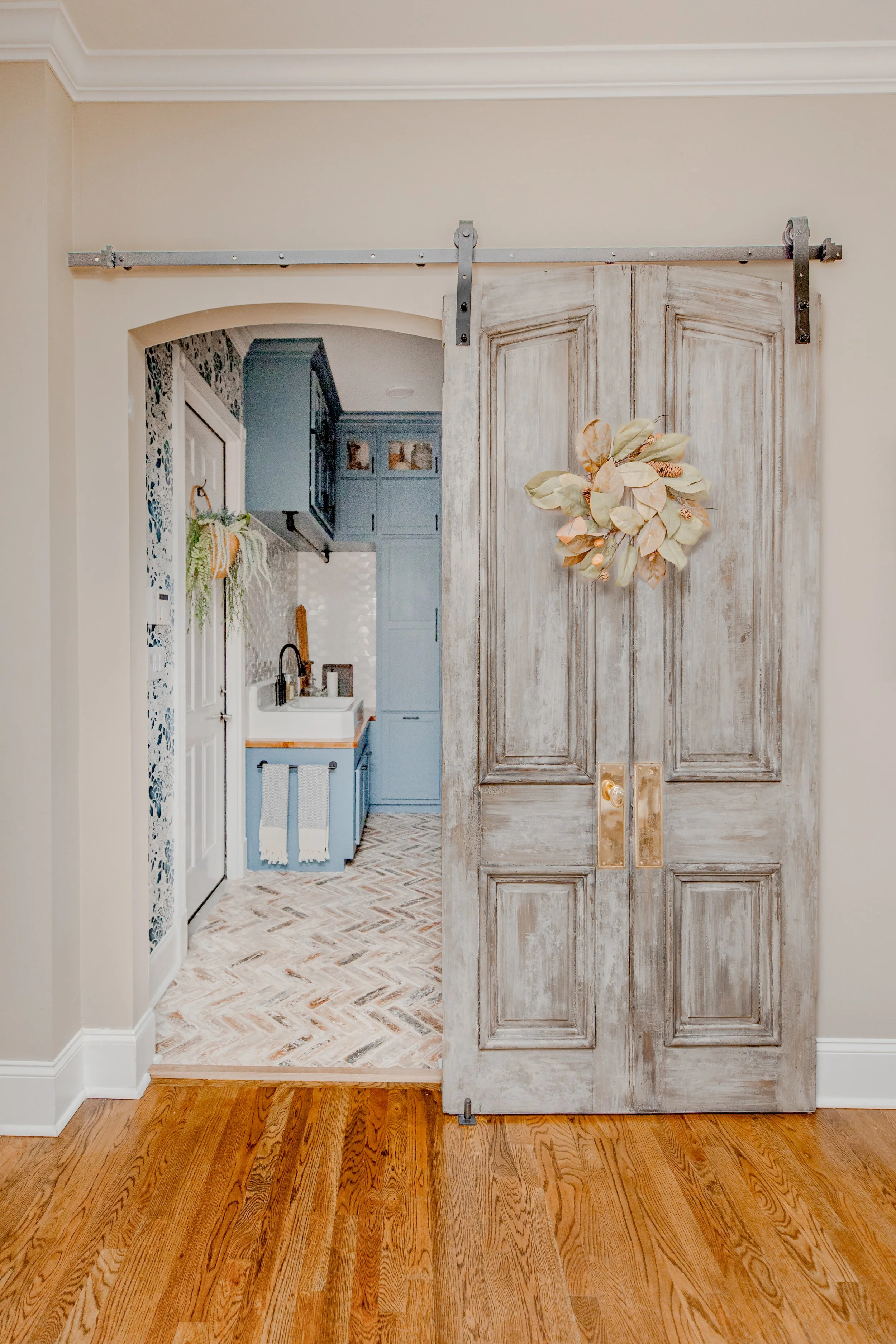 A functional yet luxurious laundry room by Cossart Design, featuring custom cabinetry, elevated finishes, and organized storage solutions that make daily routines seamless. The design combines practicality and beauty, with a sophisticated palette, el