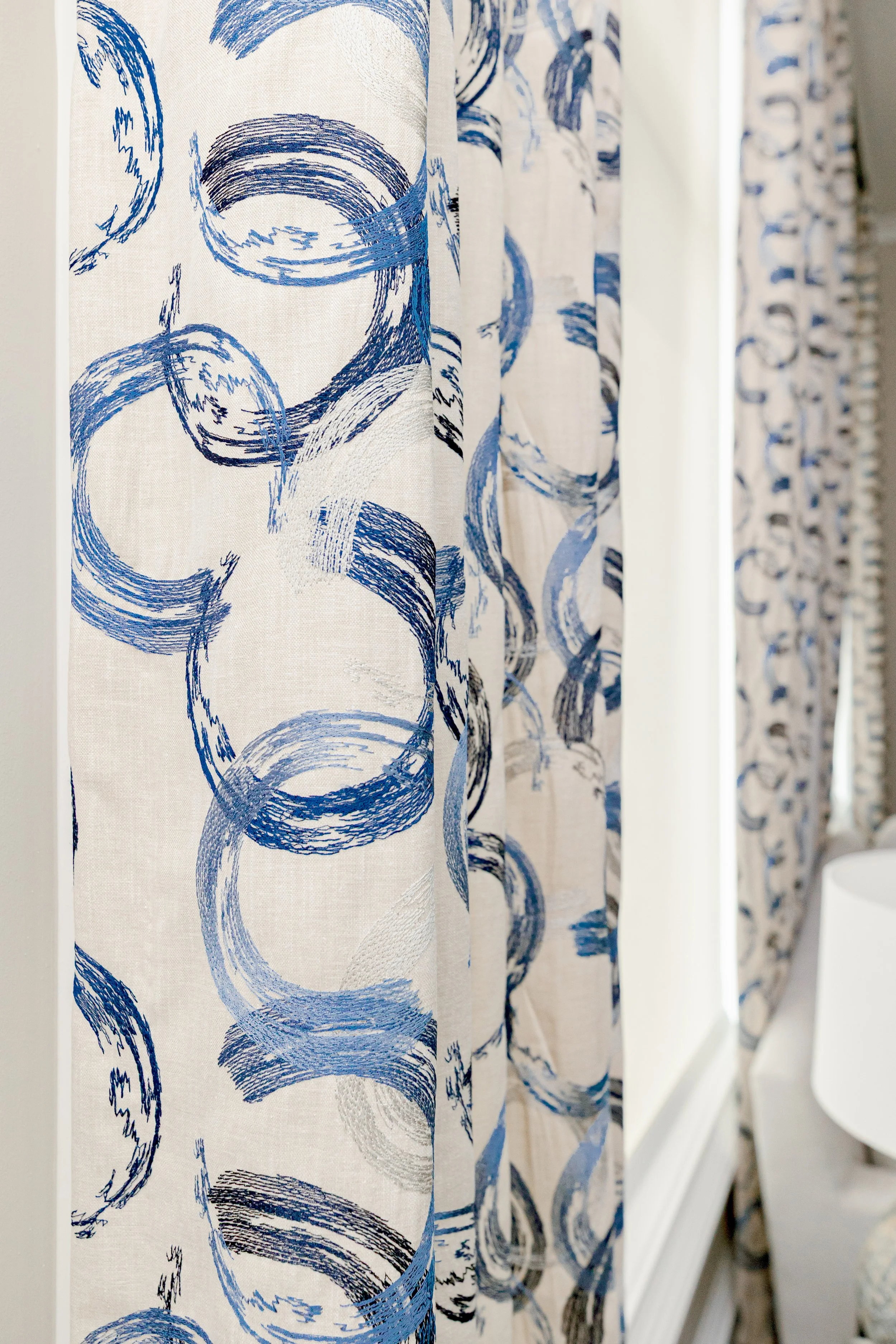 A serene master bedroom retreat designed to feel calming, refined, and restorative. Custom bedding, tailored window treatments, and motorized shades create a luxurious yet peaceful environment. Soft textures and intentional layering support daily com