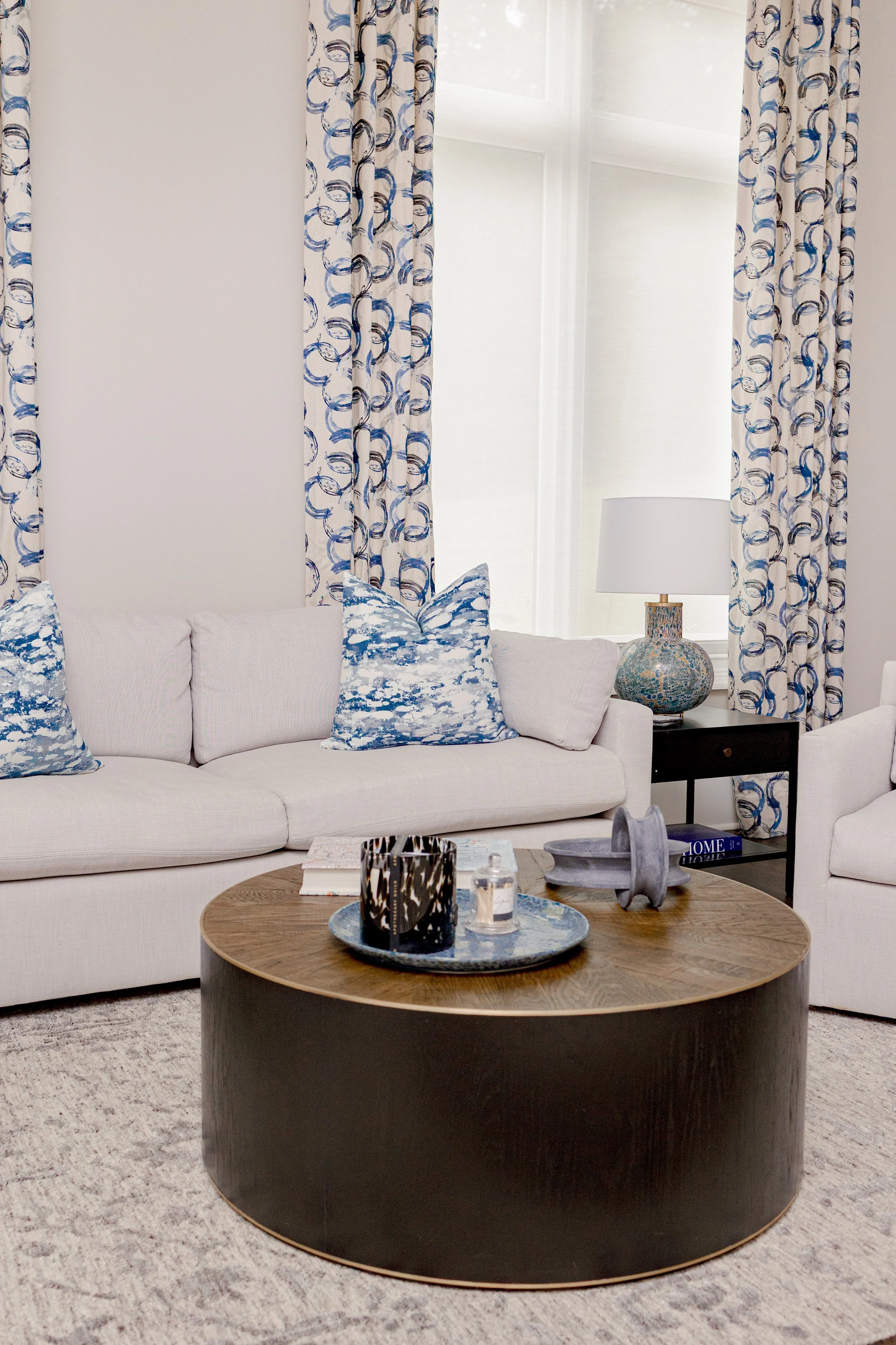 A serene master bedroom retreat designed to feel calming, refined, and restorative. Custom bedding, tailored window treatments, and motorized shades create a luxurious yet peaceful environment. Soft textures and intentional layering support daily com