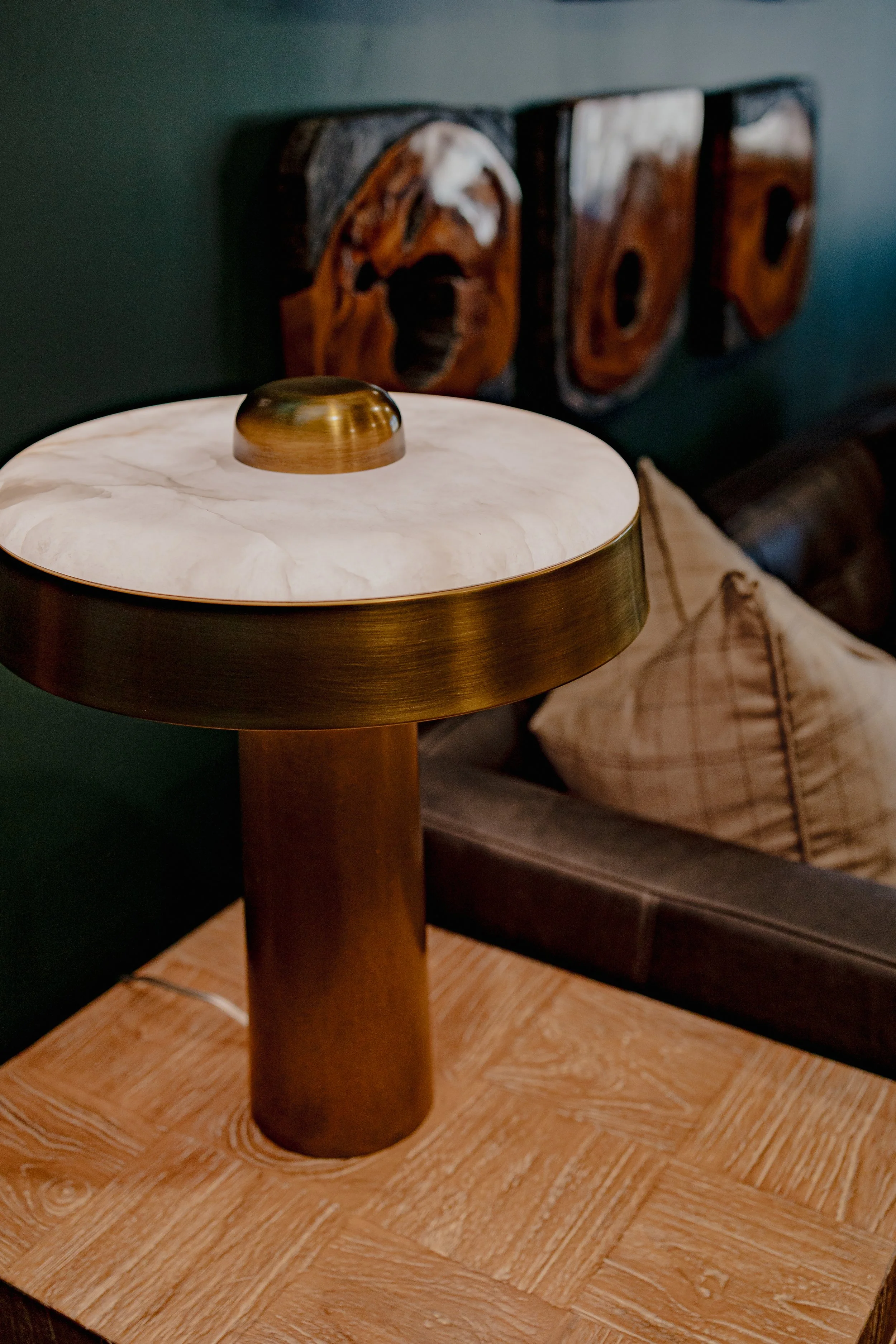 A refined cigar and whisky bar lounge designed by Cossart Design, where rich materials, warm lighting, and custom millwork come together to create a sophisticated retreat within this custom Southern home. Thoughtfully layered textures and bespoke sea