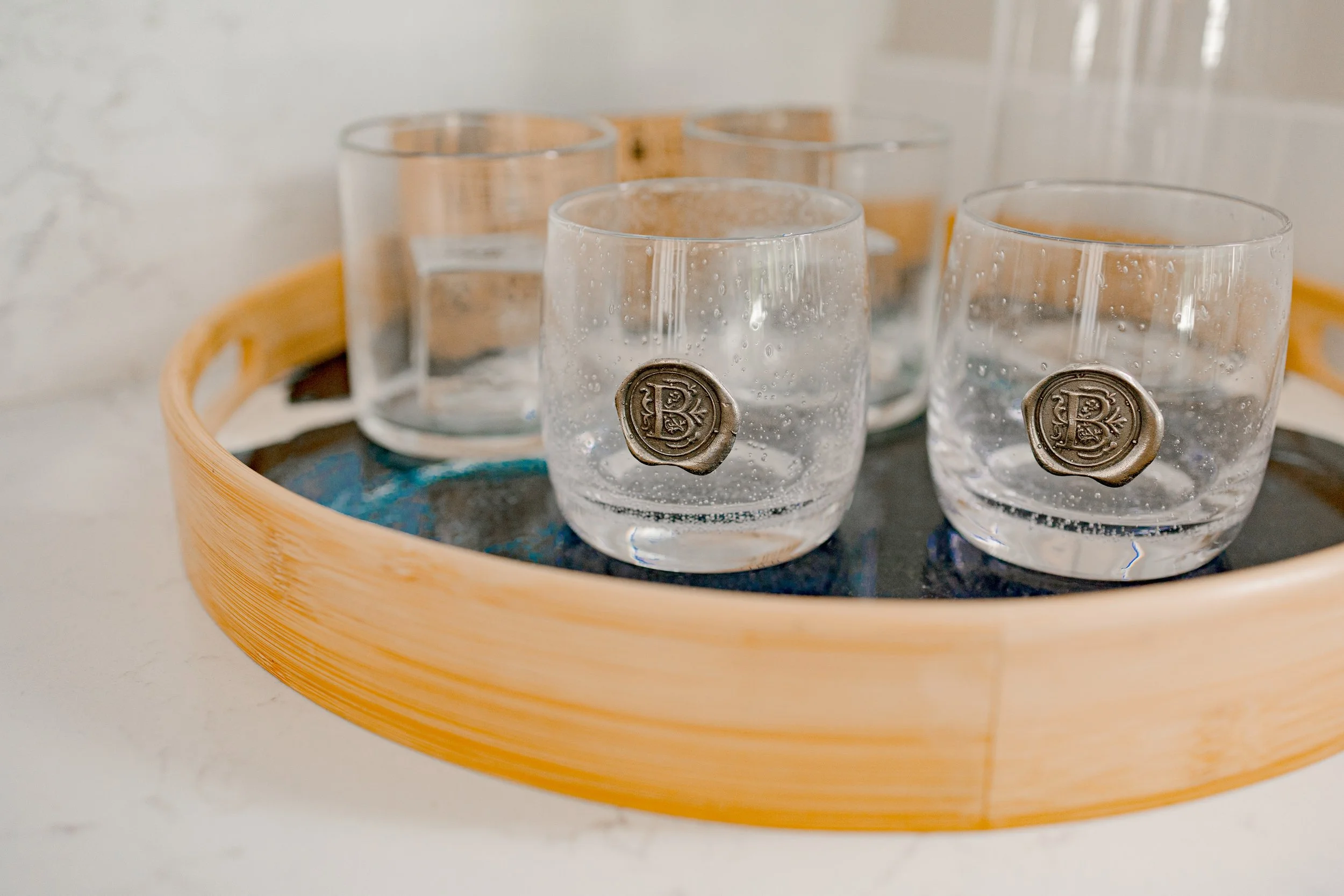 Thoughtfully selected custom design elements bring personality, function, and elevated detail to every corner of the home. From tailored lighting and mirrors to bespoke barware and decorative accents, each piece was curated to complement the space an