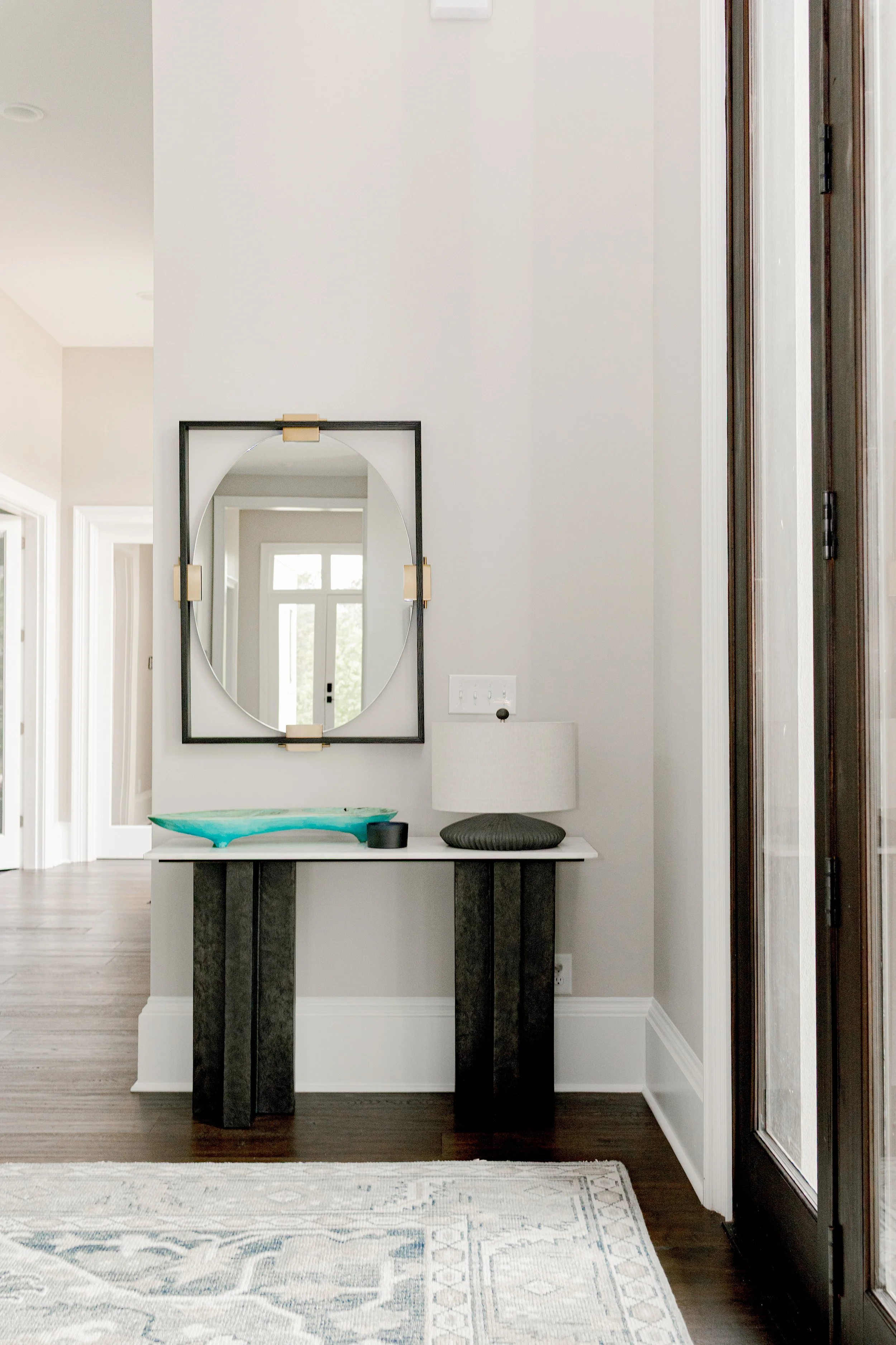 A welcoming entry designed to set the tone for the entire home. Clean lines, intentional styling, and balanced proportions create a refined first impression while inviting guests inward. This space reflects cohesive interior design that feels elevate