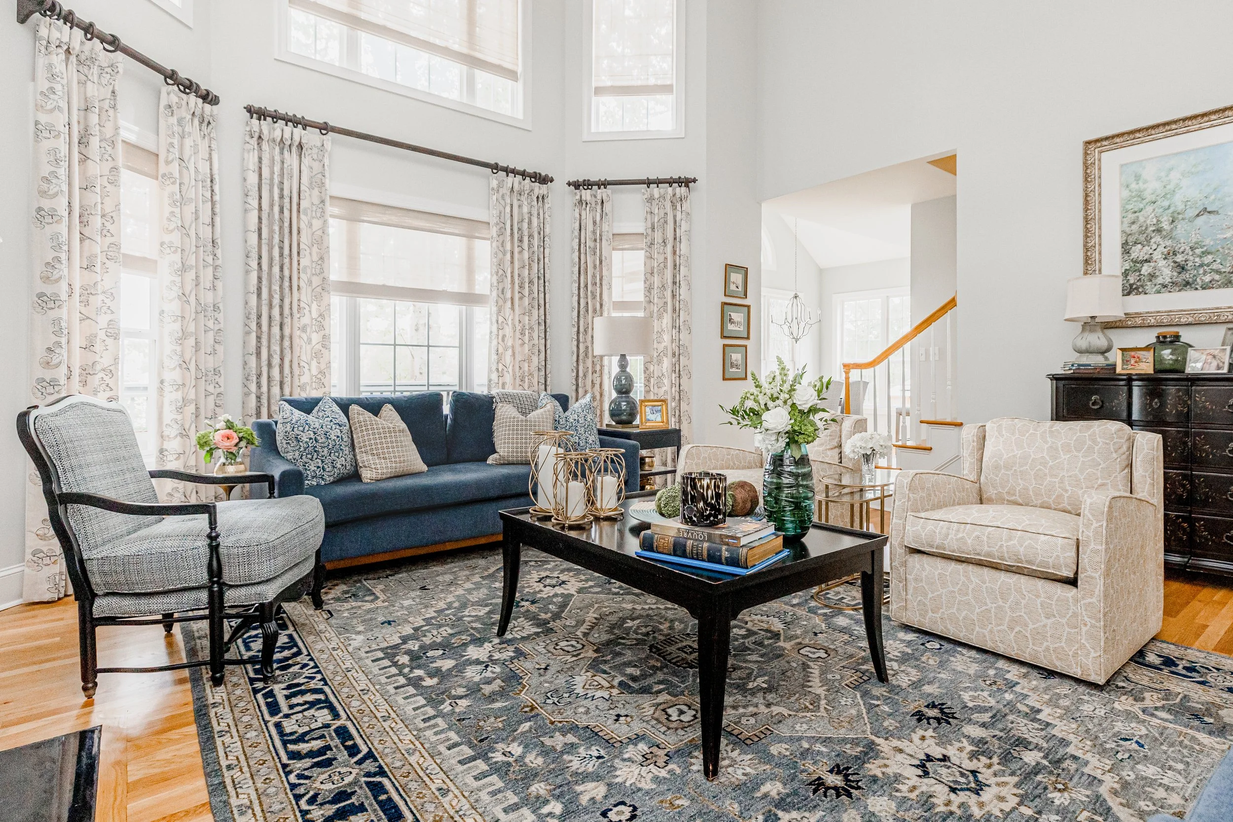 A quintessential Southern formal living room by Cossart Design, blending classic elegance with modern comfort. Warm tones, layered textures, and tailored furnishings create a welcoming space for entertaining or quiet afternoons. Thoughtful accents an