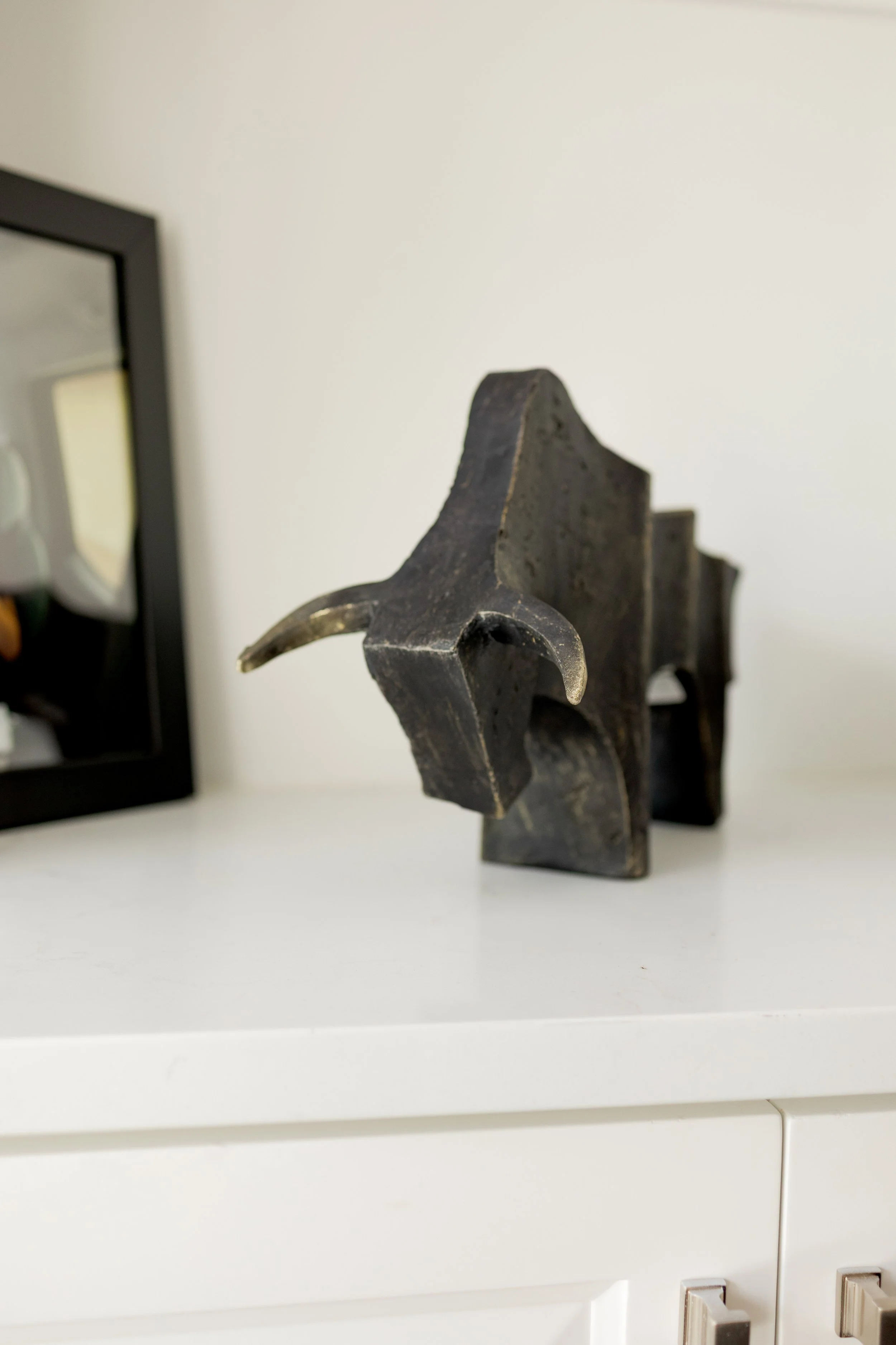 Thoughtfully selected custom design elements bring personality, function, and elevated detail to every corner of the home. From tailored lighting and mirrors to bespoke barware and decorative accents, each piece was curated to complement the space an