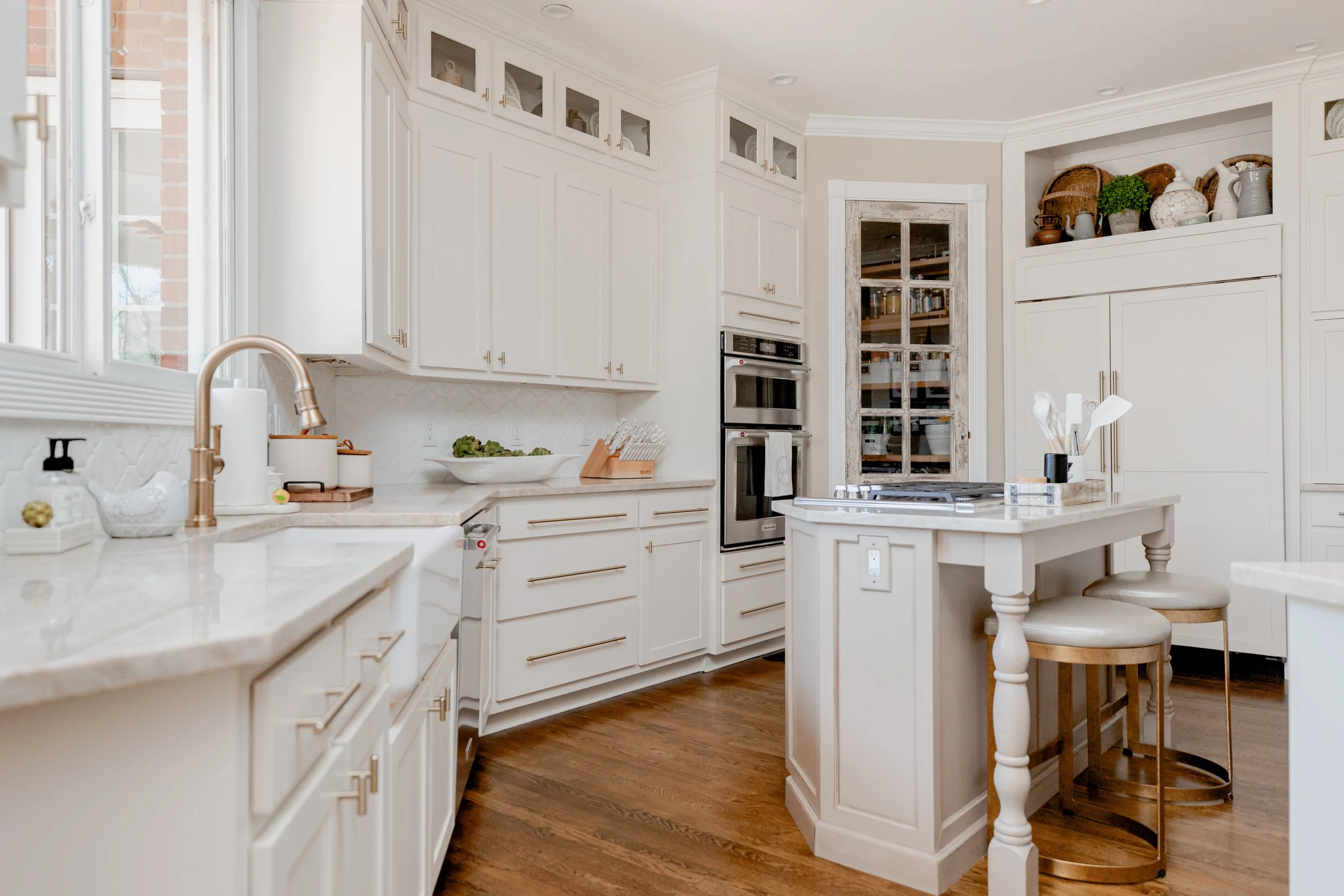 A classic and refined kitchen by Cossart Design, with custom cabinetry, high-end finishes, and a thoughtful layout that balances everyday functionality with elegant design. The space features bespoke details, tailored lighting, and coordinated materi