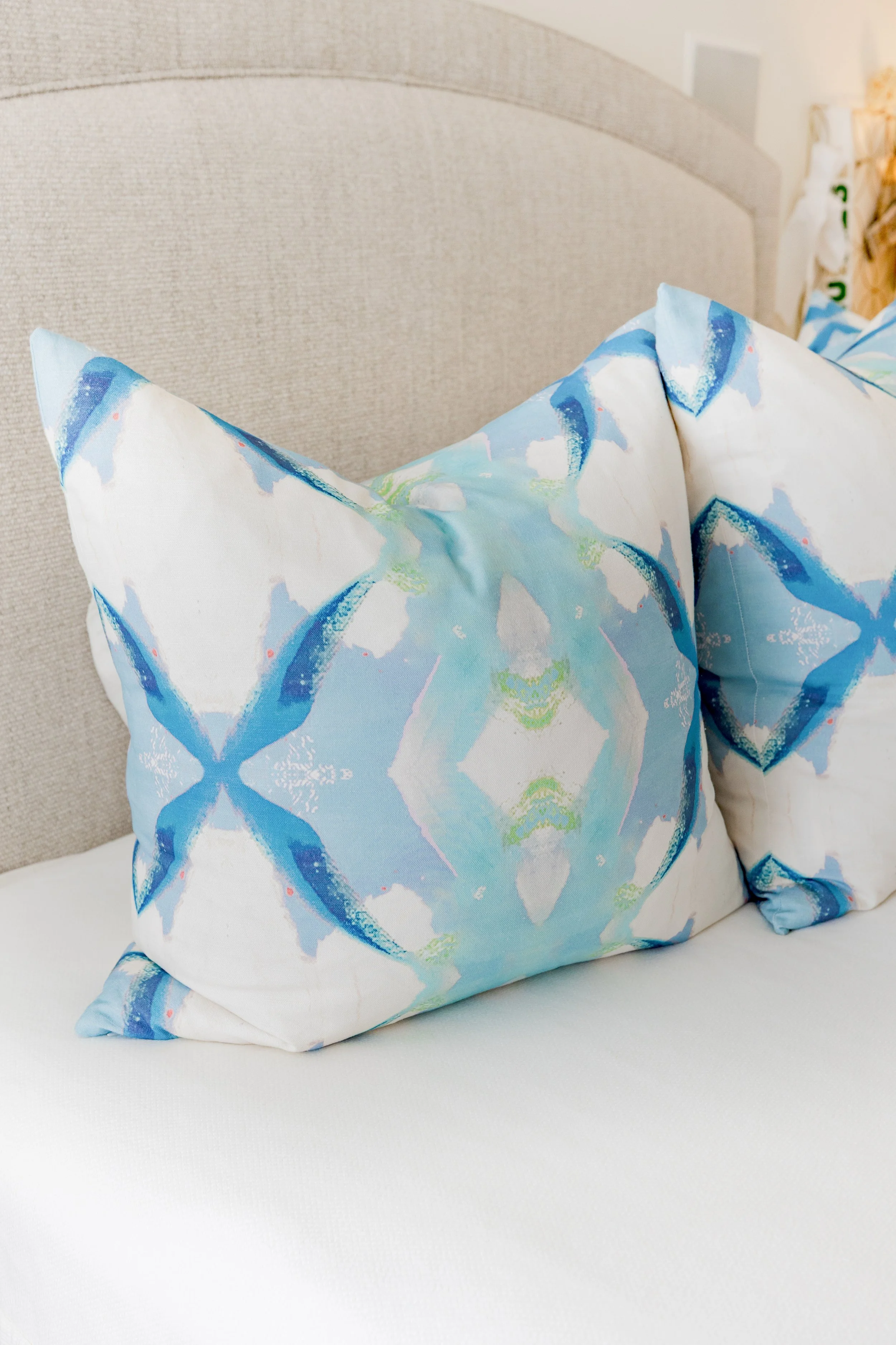 Custom-designed bedding and pillows add a final layer of luxury, bringing texture, color, and personality to the space. Carefully selected fabrics and tailored details elevate the bedroom, creating a cohesive and intentional design that feels both re