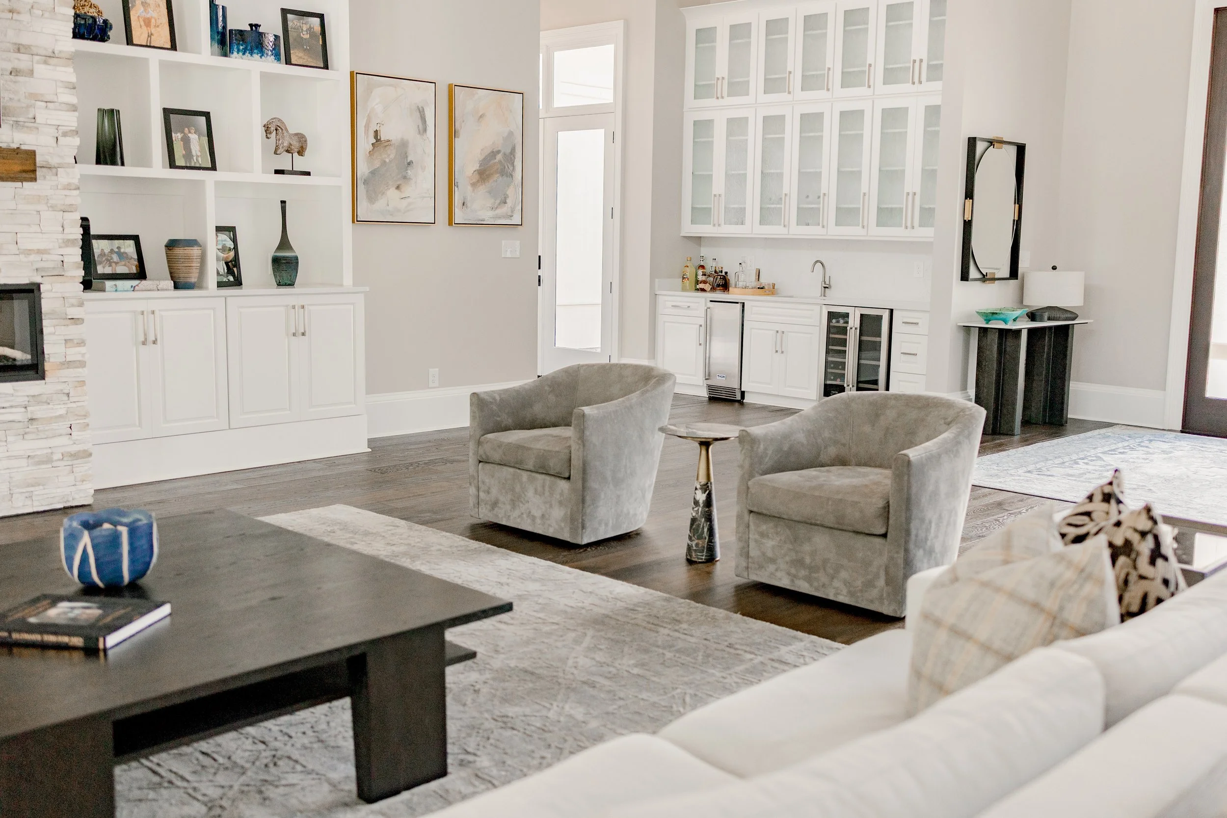 A beautifully layered living room designed to balance comfort, style, and everyday living. Thoughtful furniture placement, layered textures, and custom finishes create a space that is both functional and inviting for entertaining or quiet family mome