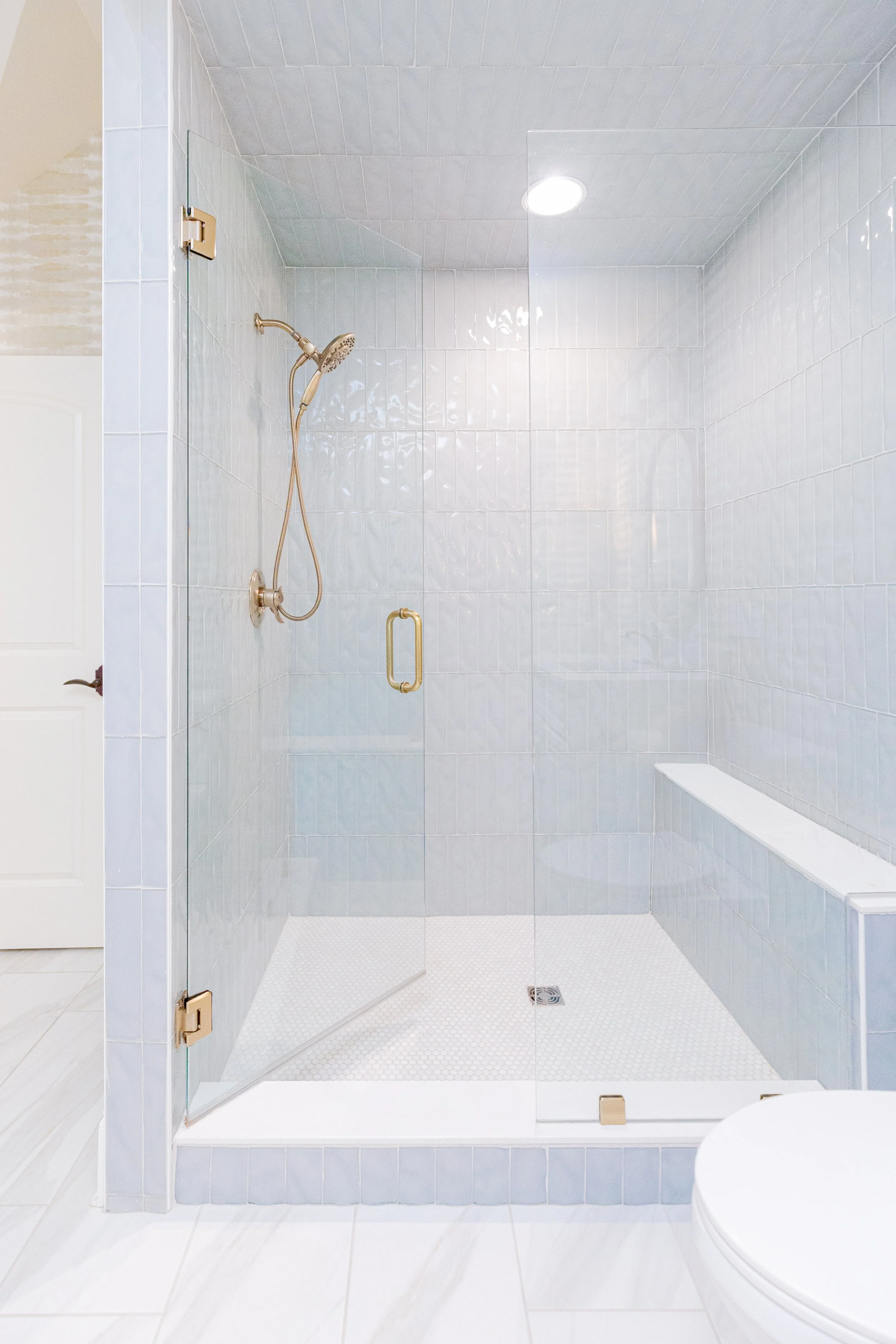 A private en-suite bathroom designed as a personal retreat, where custom selections and elevated finishes create a sense of quiet luxury. Thoughtful layouts, tailored vanities, and refined materials come together to deliver both beauty and function i