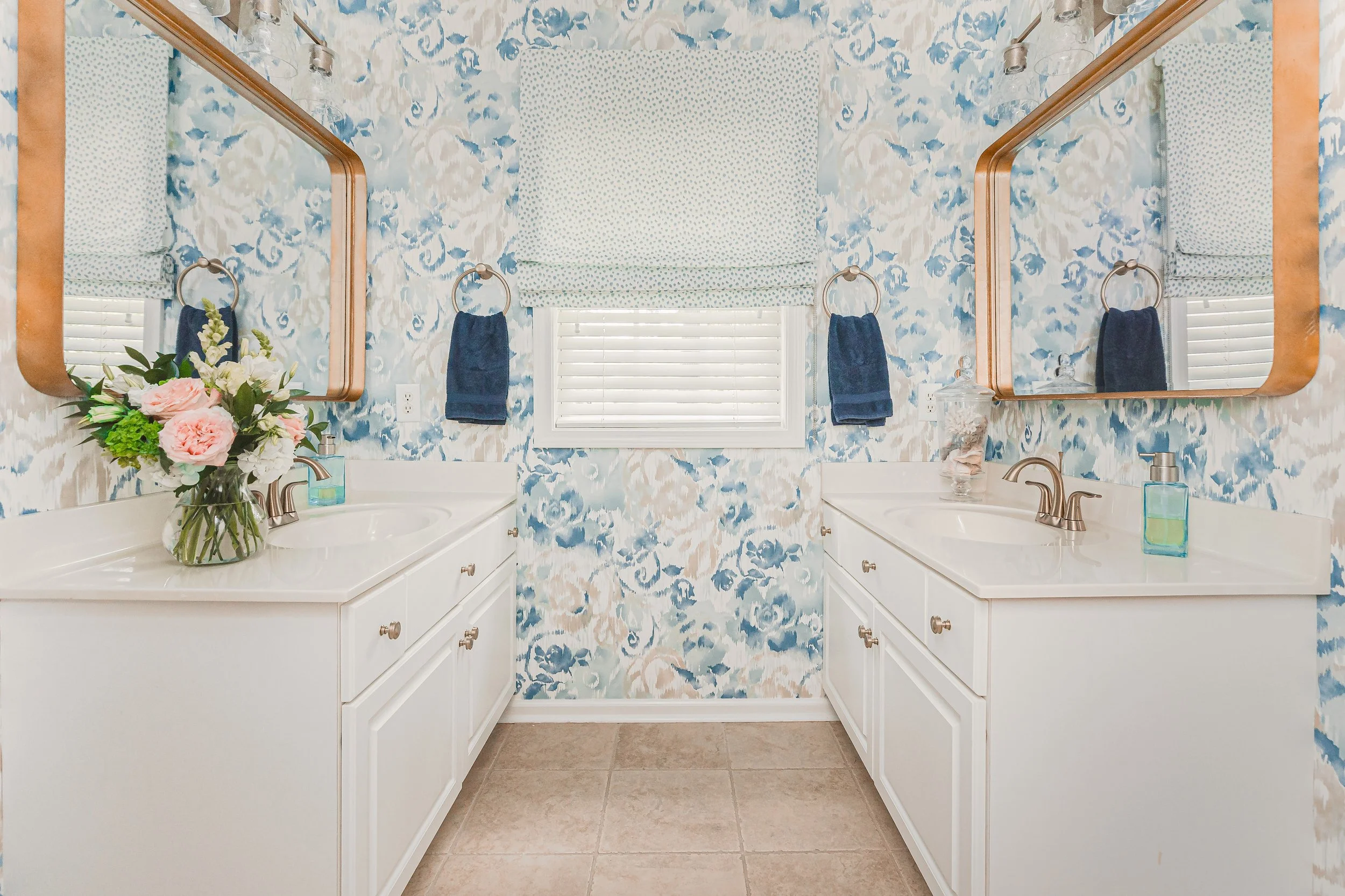 A luxurious custom bathroom designed by Cossart Design, featuring gold fixtures, elegant wallpaper and finishes, and bespoke window treatments. The space is designed for comfort and style, creating a functional yet elevated retreat within the home.
#