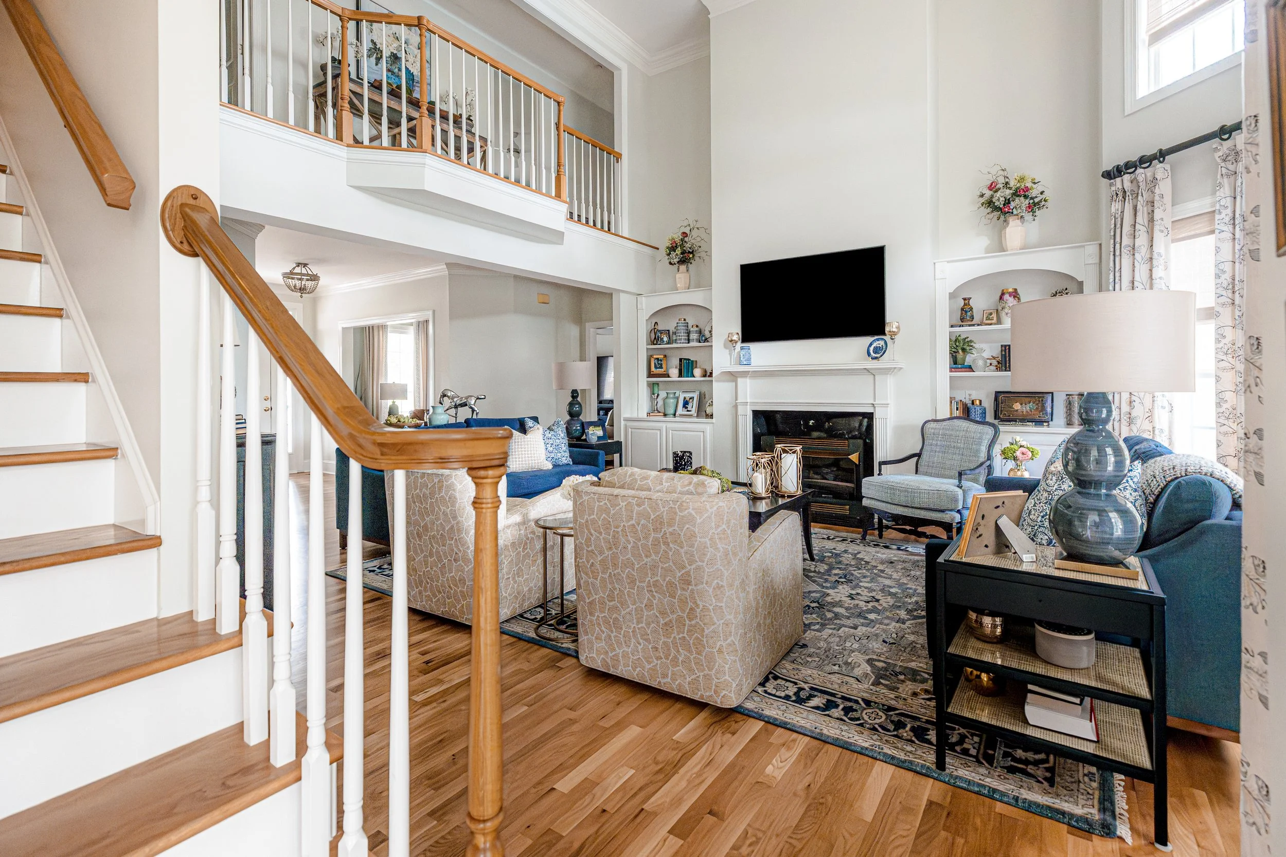 A quintessential Southern formal living room by Cossart Design, blending classic elegance with modern comfort. Warm tones, layered textures, and tailored furnishings create a welcoming space for entertaining or quiet afternoons. Thoughtful accents an