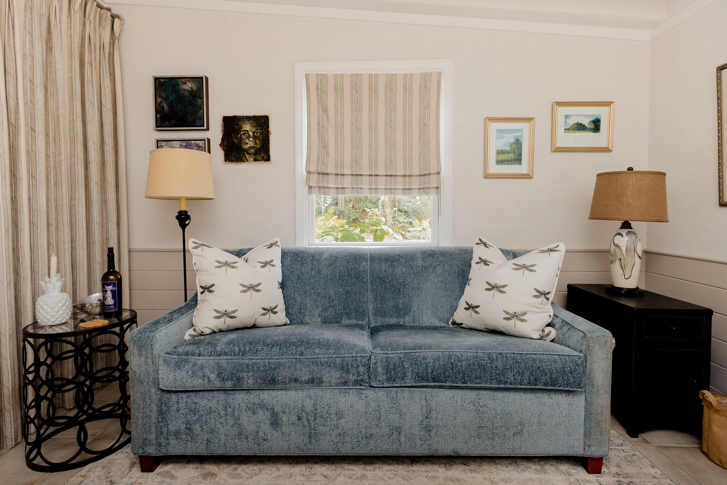 A custom designed seating area with thoughtfully selected fabrics and bespoke finishes, reflecting Cossart Design’s approach to creating interiors that feel personal and artful. Rich textures and vibrant accents elevate this space while keeping it co