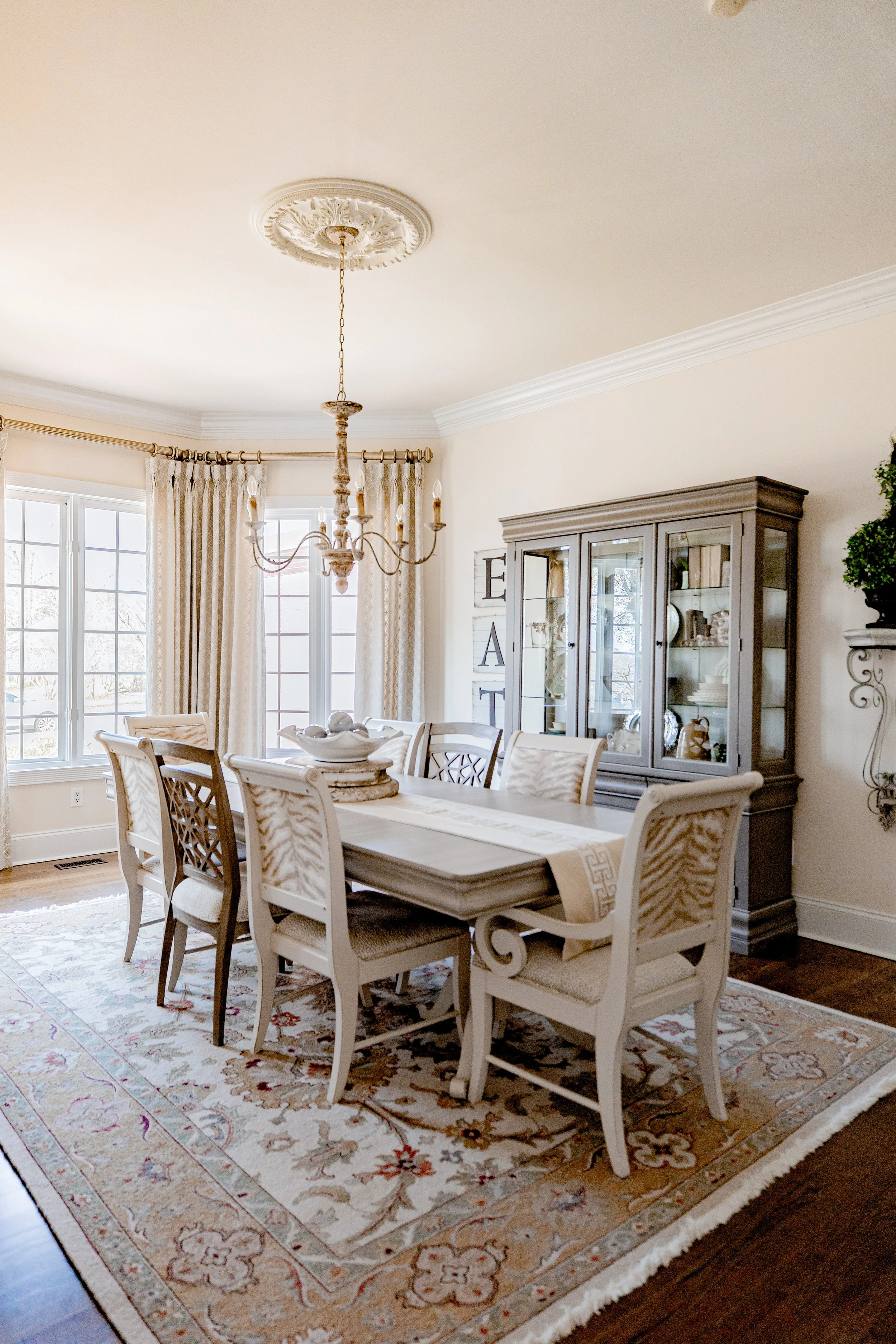 An elevated formal dining room by Cossart Design, designed for sophisticated entertaining and memorable gatherings. Custom furniture, layered lighting, and curated finishes create a warm yet refined atmosphere. The space balances function and style, 