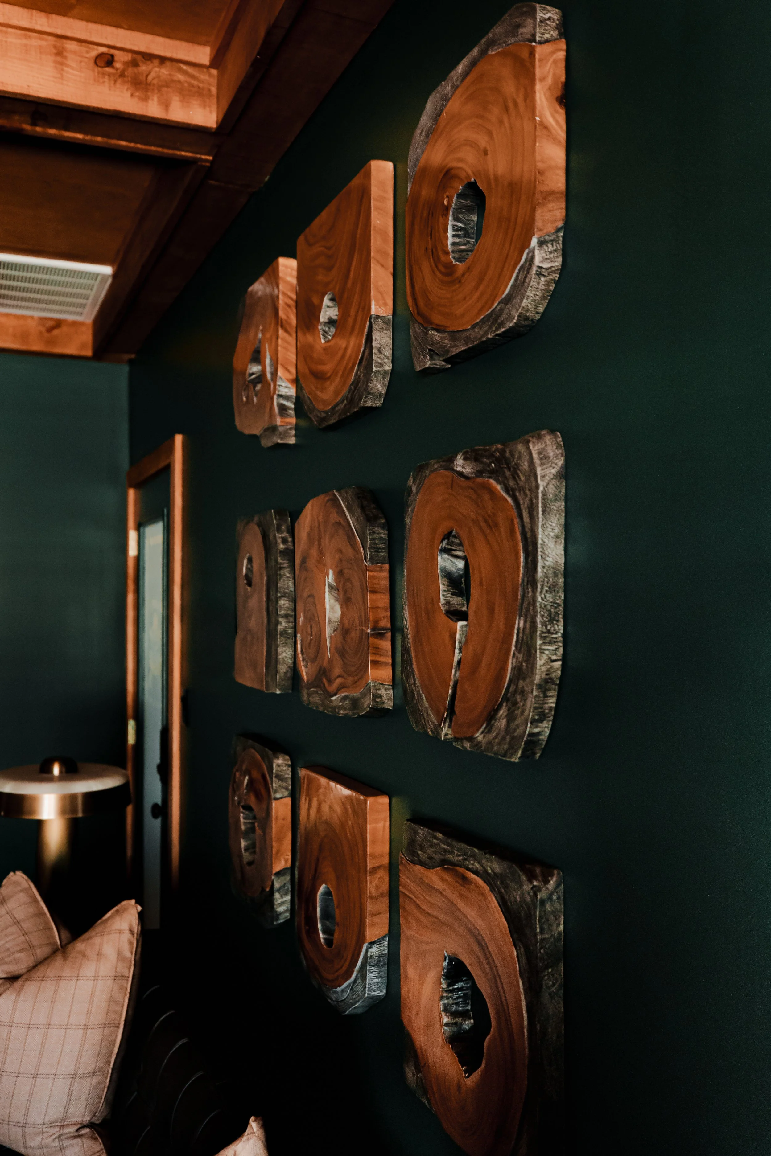 A refined cigar and whisky bar lounge designed by Cossart Design, where rich materials, warm lighting, and custom millwork come together to create a sophisticated retreat within this custom Southern home. Thoughtfully layered textures and bespoke sea