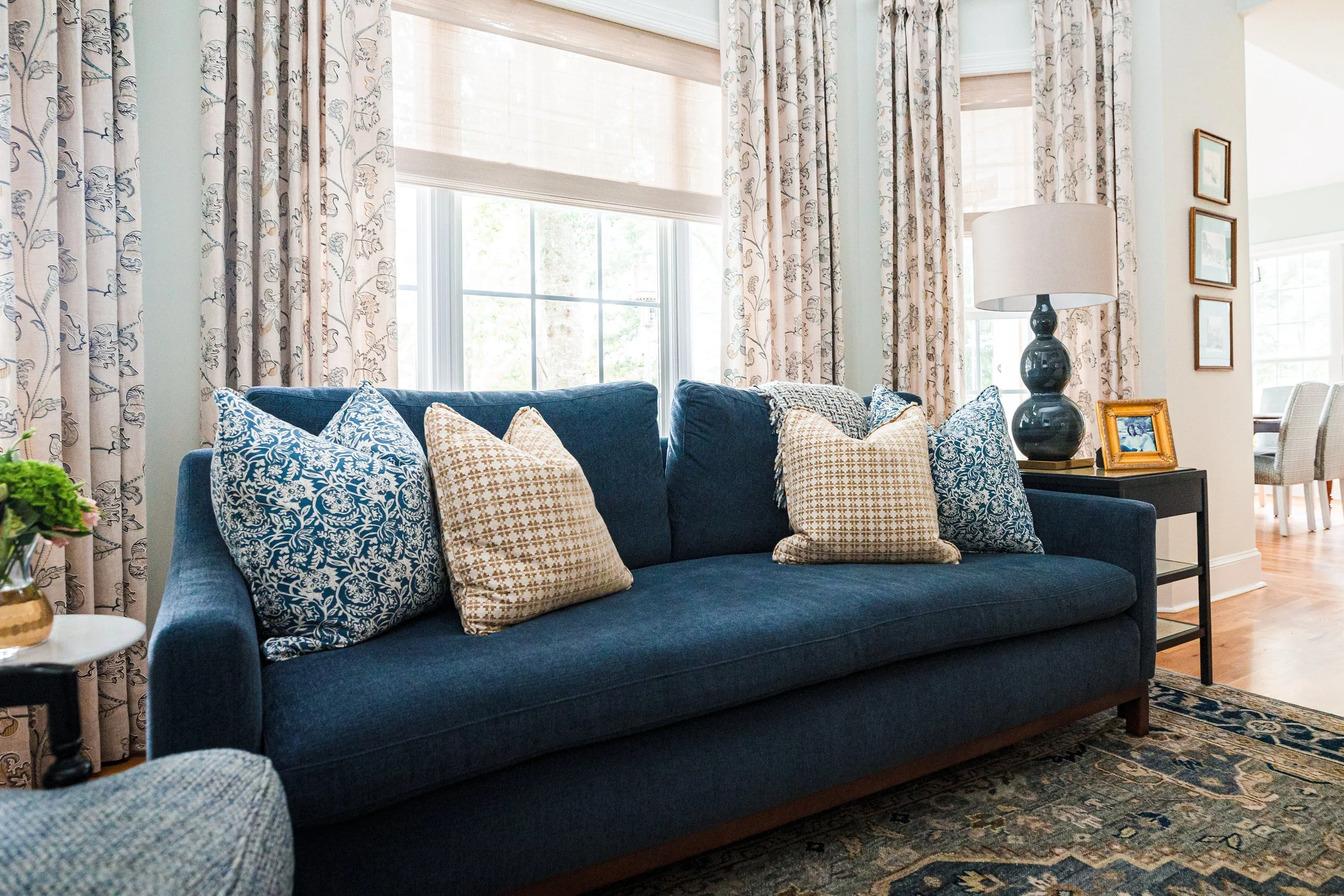 A quintessential Southern formal living room by Cossart Design, blending classic elegance with modern comfort. Warm tones, layered textures, and tailored furnishings create a welcoming space for entertaining or quiet afternoons. Thoughtful accents an