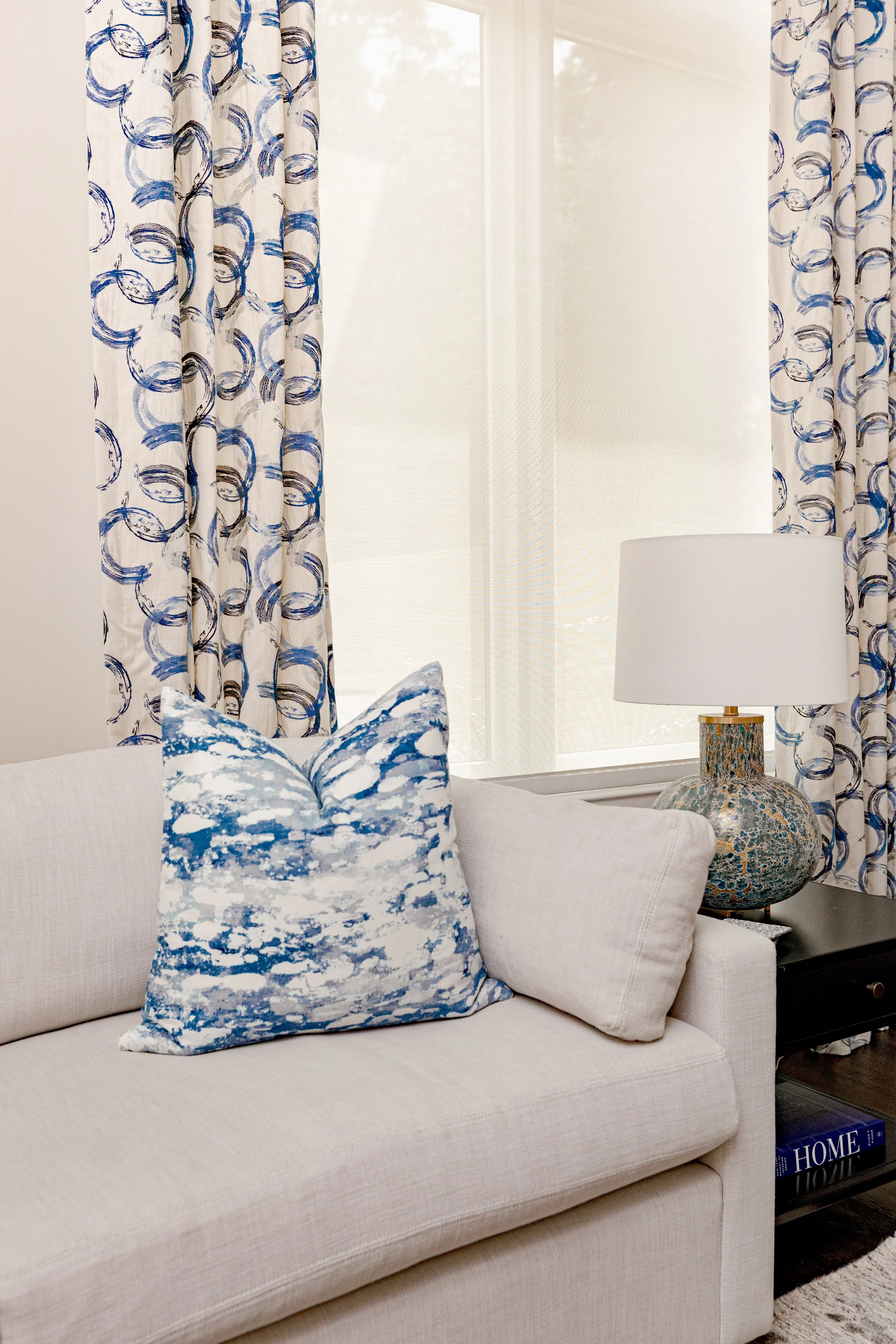 A serene master bedroom retreat designed to feel calming, refined, and restorative. Custom bedding, tailored window treatments, and motorized shades create a luxurious yet peaceful environment. Soft textures and intentional layering support daily com