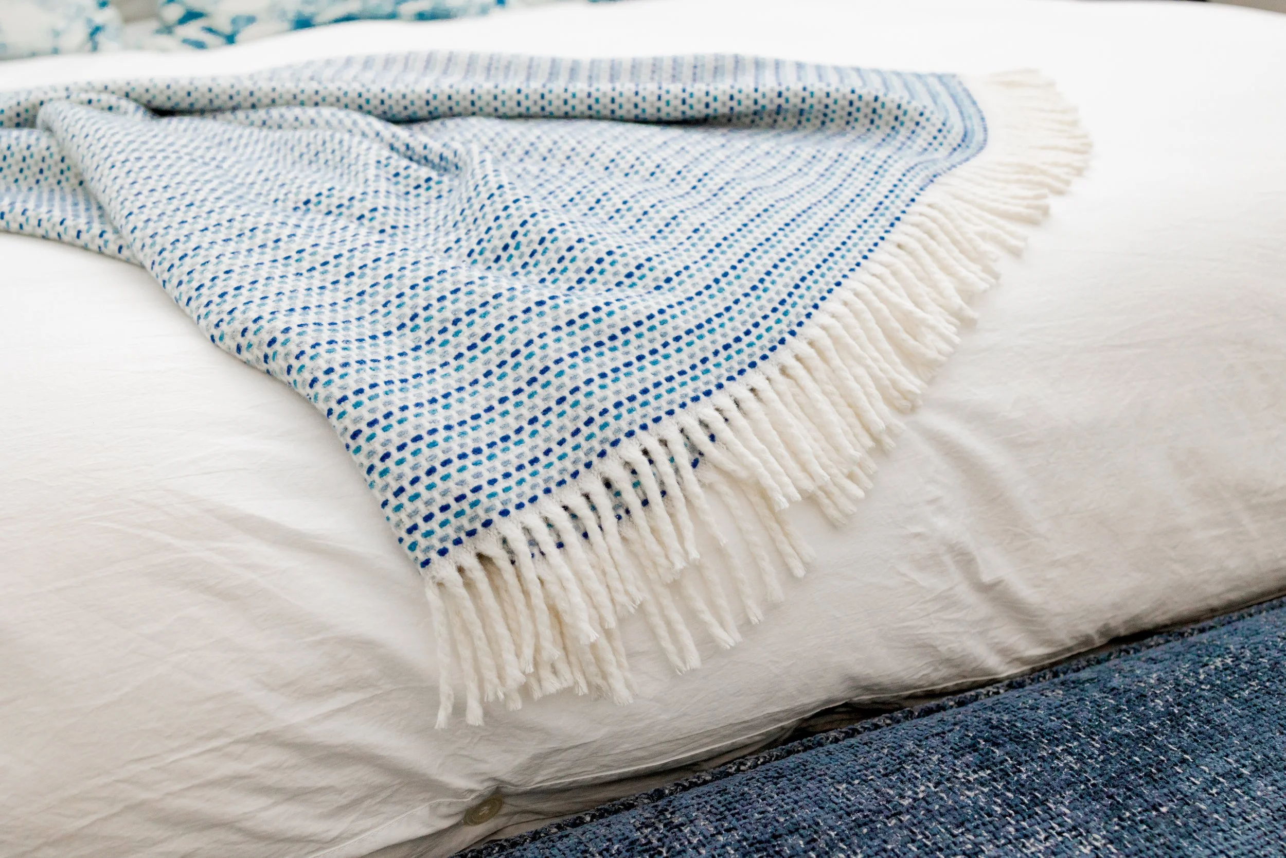 A serene master bedroom retreat designed to feel calming, refined, and restorative. Custom bedding, tailored window treatments, and motorized shades create a luxurious yet peaceful environment. Soft textures and intentional layering support daily com