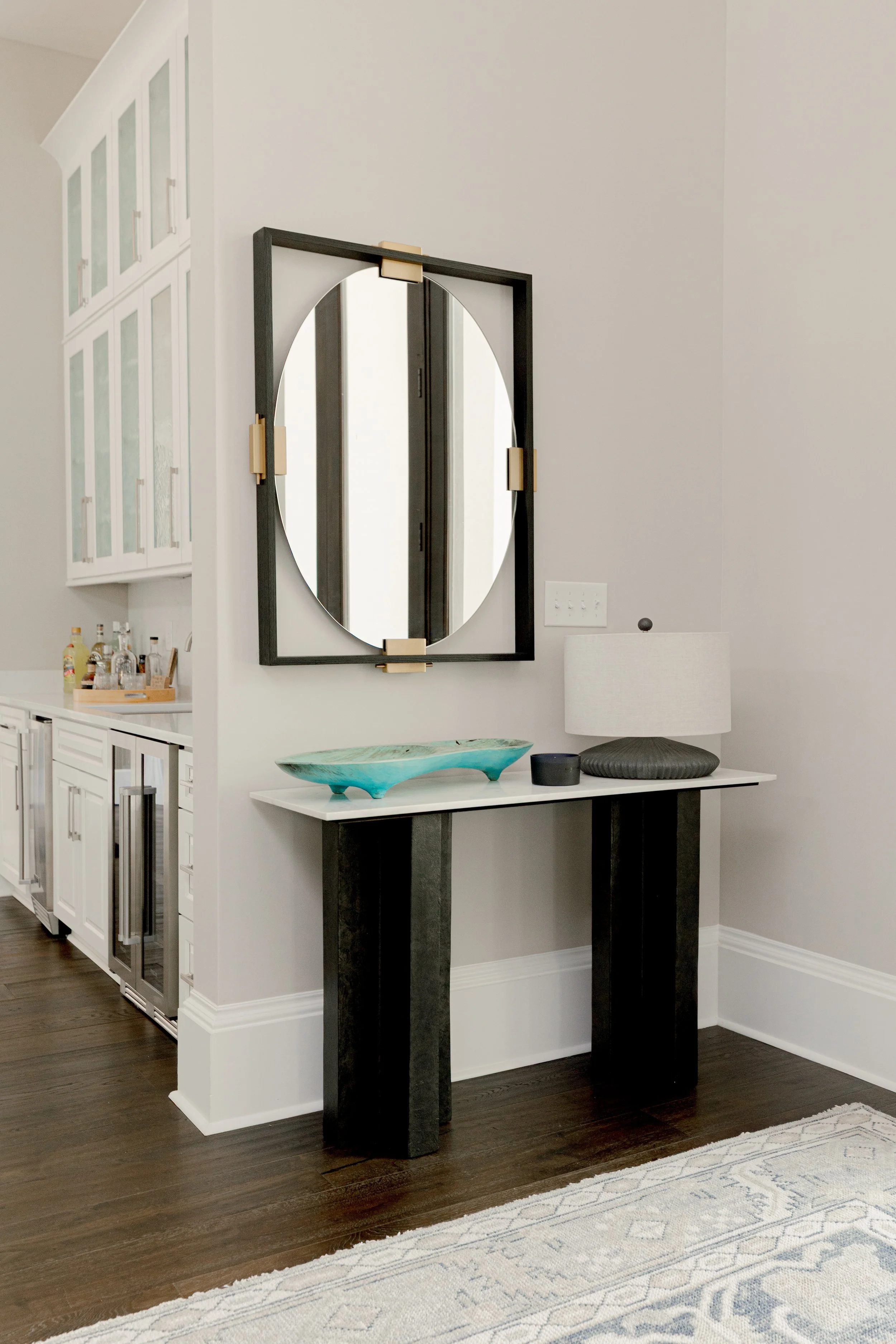 A welcoming entry designed to set the tone for the entire home. Clean lines, intentional styling, and balanced proportions create a refined first impression while inviting guests inward. This space reflects cohesive interior design that feels elevate