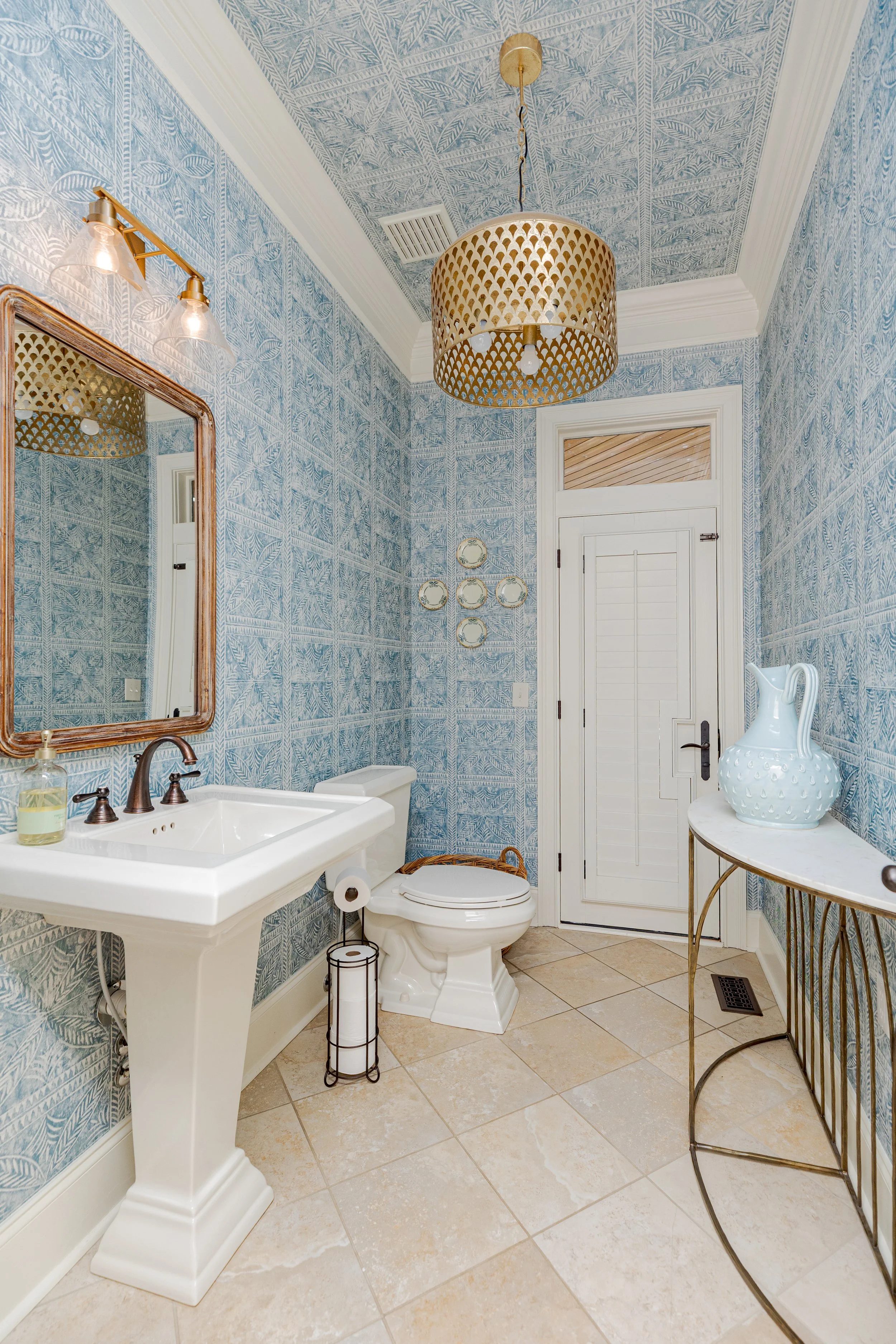 This bathroom was designed to feel both functional and elevated. Clean lines, thoughtful finishes, gold hardware with textured, bright wallpaper, and intentional details bring a sense of ease and refinement to an everyday space.

#InteriorDesign #Bat