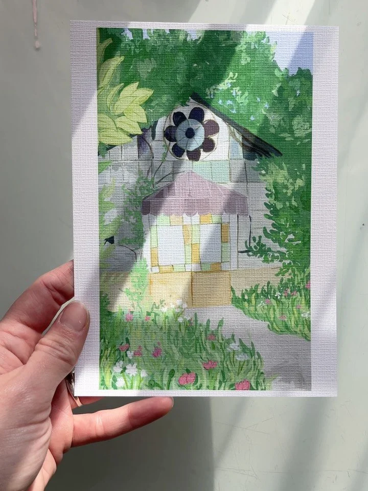 A greenhouse forgotten in time. The plants slowly grow over the outside, reclaiming it. 

The colored stained glass seems to play with the lush green forest where it lives. But the path seems well traveled by someone. Maybe who stills visits this bea
