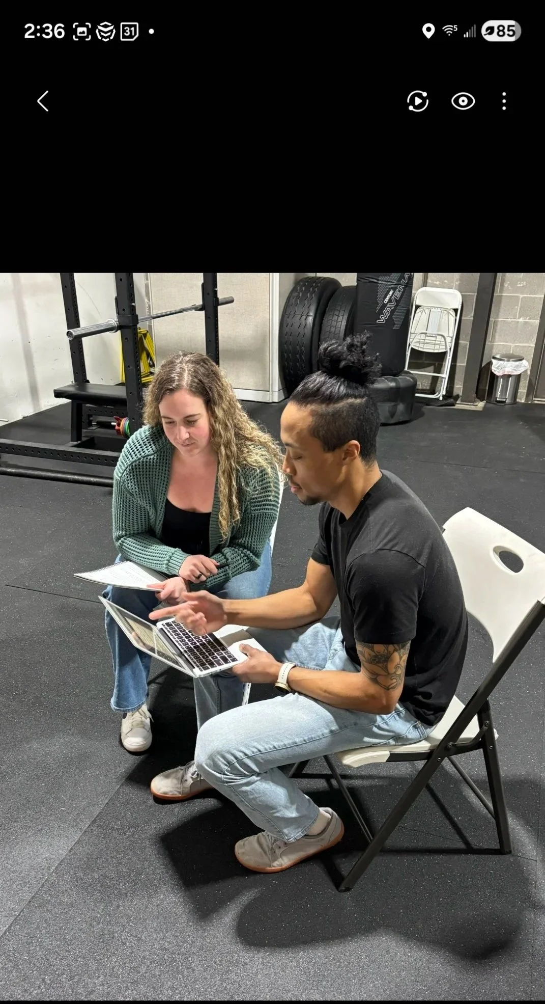 A laptop with a yellow screen displaying a message that says 'Under Construction' in a modern design with icons and graphics.