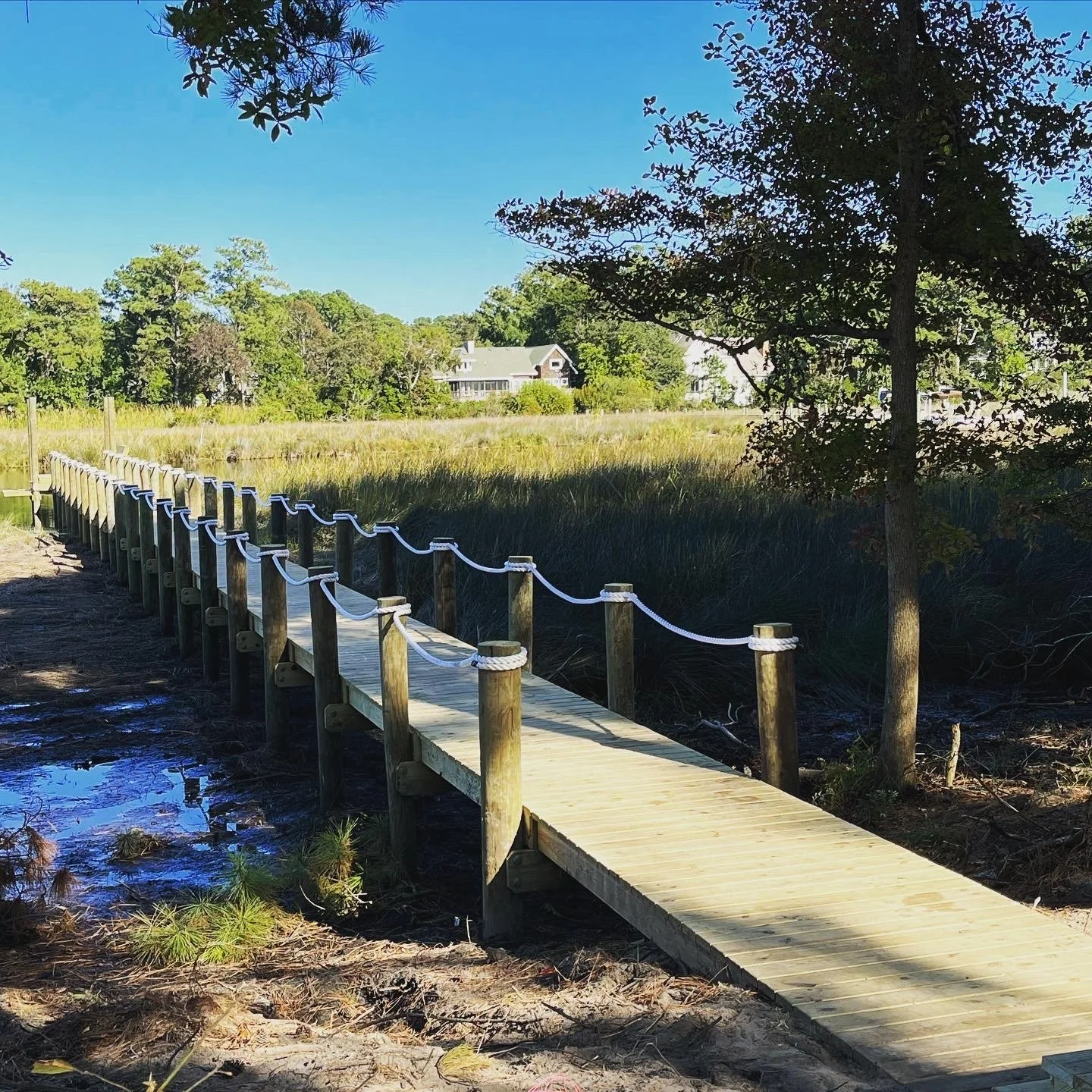 pier with rope railing over sound